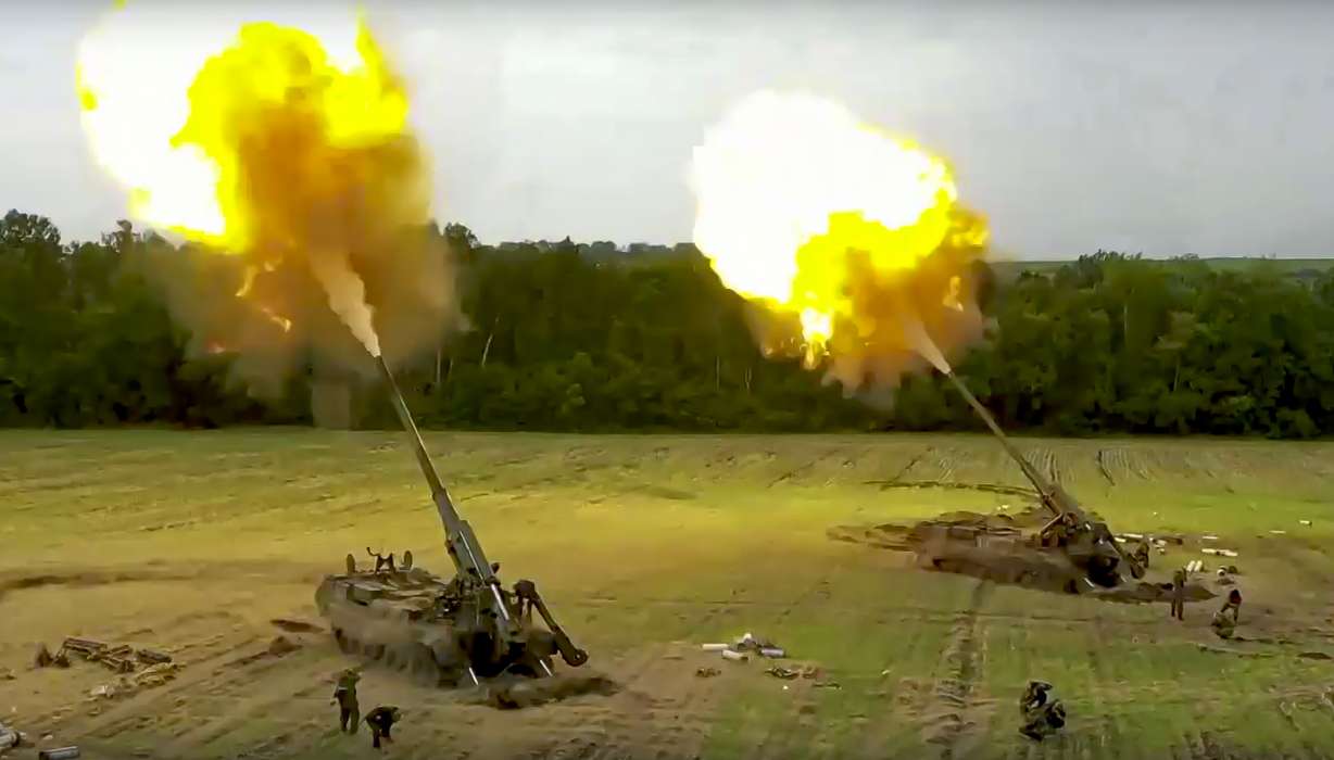 In this handout photo taken from video released by the Russian Defense Ministry Press Service on Thursday, Russian Malka artillery systems fire from an undisclosed location in Ukraine.