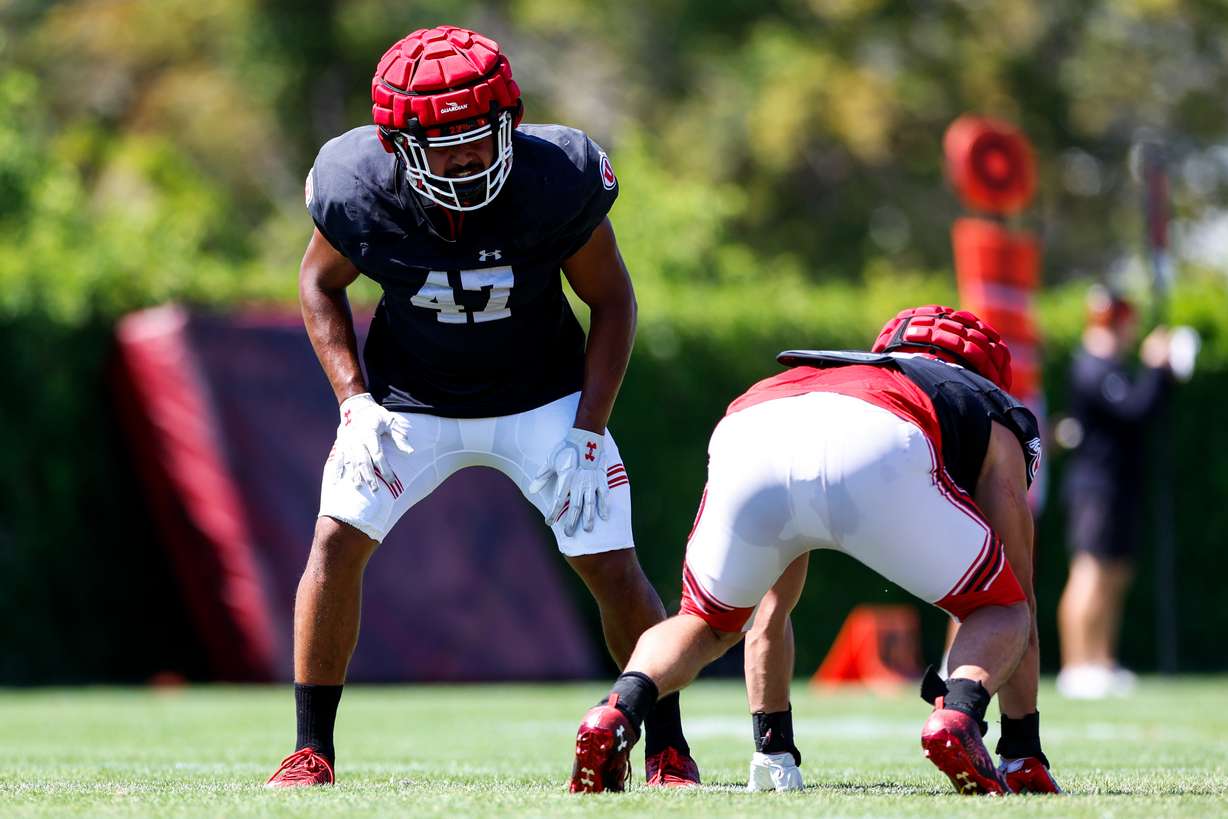 Sophomore defensive end Miki Suguturaga lines up during drills as part of Utah's fall camp practices in Salt Lake City on Aug. 9, 2022.