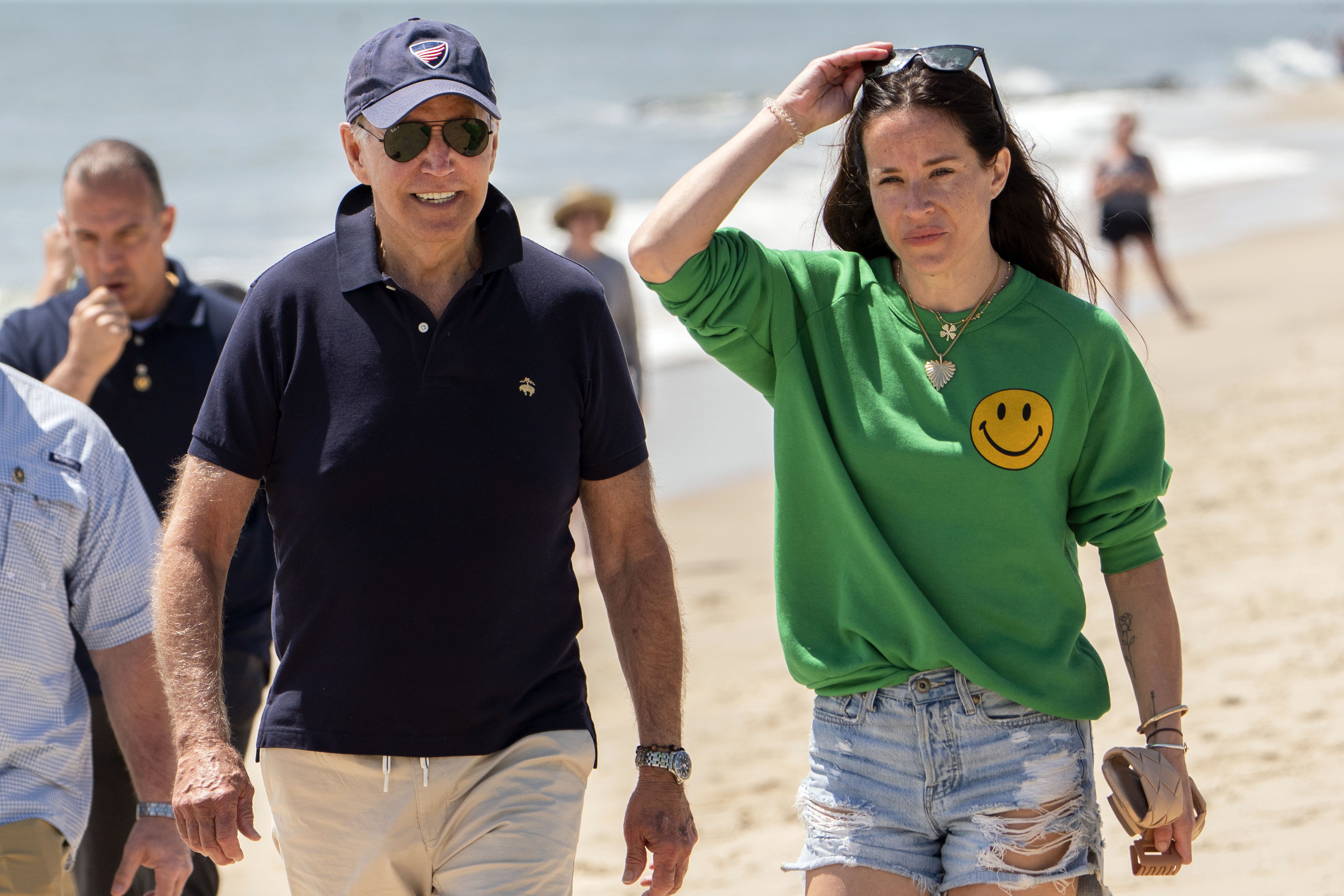 President Joe Biden walks on the beach with daughter Ashley Biden, in Rehoboth Beach, Del., June 20. Two people have pleaded guilty in a scheme to peddle a diary and other items belonging to President Joe Biden's daughter Ashley to the conservative group Project Veritas, prosecutors said Thursday. 