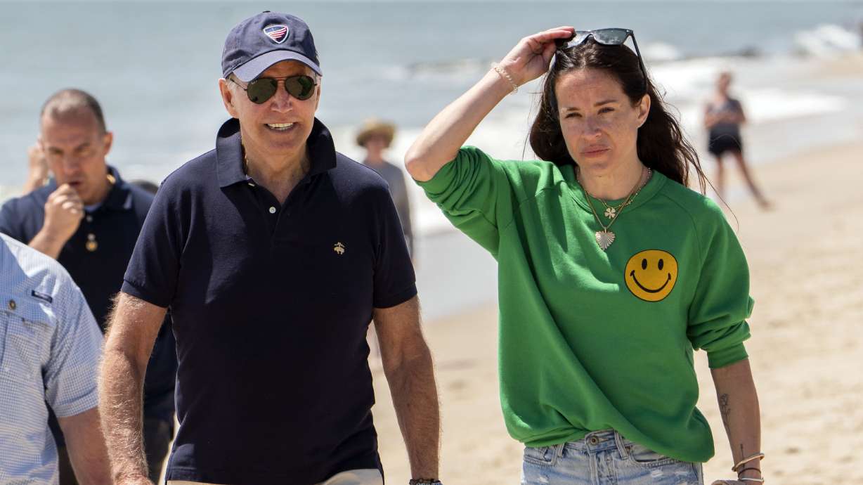 President Joe Biden walks on the beach with daughter Ashley Biden, in Rehoboth Beach, Del., June 20. Two people have pleaded guilty in a scheme to peddle a diary and other items belonging to President Joe Biden's daughter Ashley to the conservative group Project Veritas, prosecutors said Thursday.