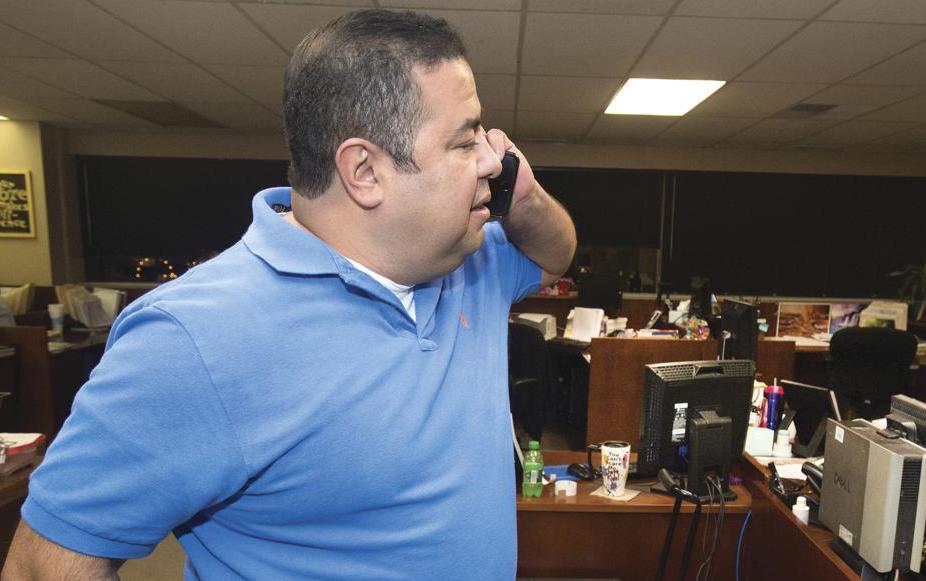 Pueblo County Clerk Gilbert “Bo” Ortiz checks the status of voting machines that apparently failed to work correctly, causing long delays in election results being released on Nov, 8, 2016 in Pueblo, Colo. In Pueblo County, election officials are preparing for every possibility during the November general election. 