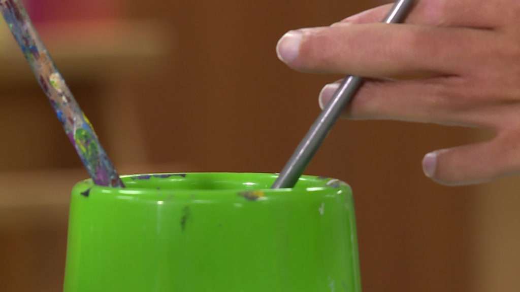 Katelyn Pugmire paints at the Work Activity Center in West Valley. It’s a place for any adult living with a disability to do activities and have fun with others.