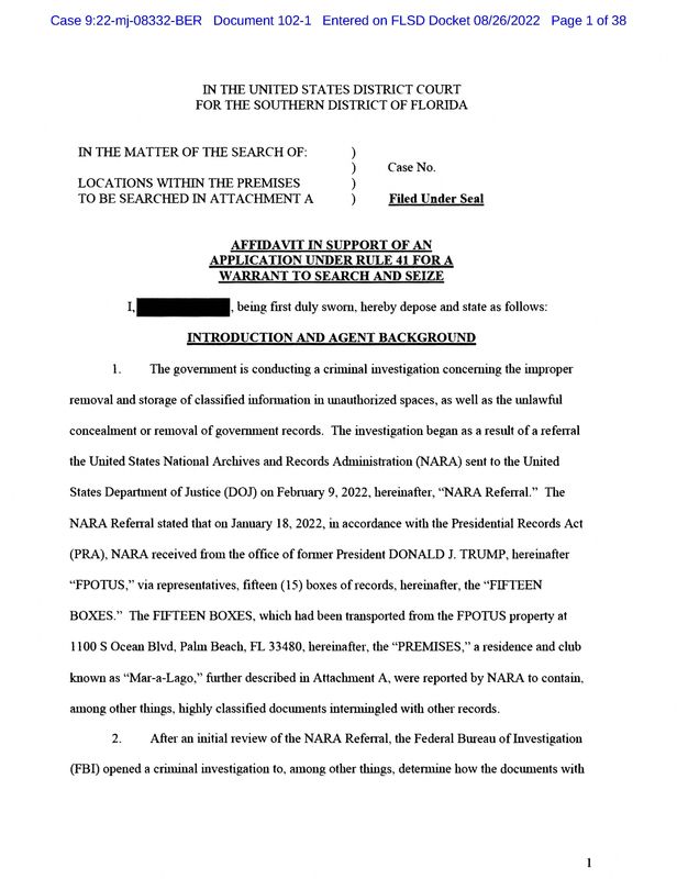 The first page of the redacted version of an affidavit from the U.S. Justice Department submitted to a federal judge to support the execution of a search warrant by the FBI at former President Donald Trump's Mar-a-Lago estate is seen after being released by the U.S. District Court for the Southern District of Florida in West Palm Beach, Florida, Friday.