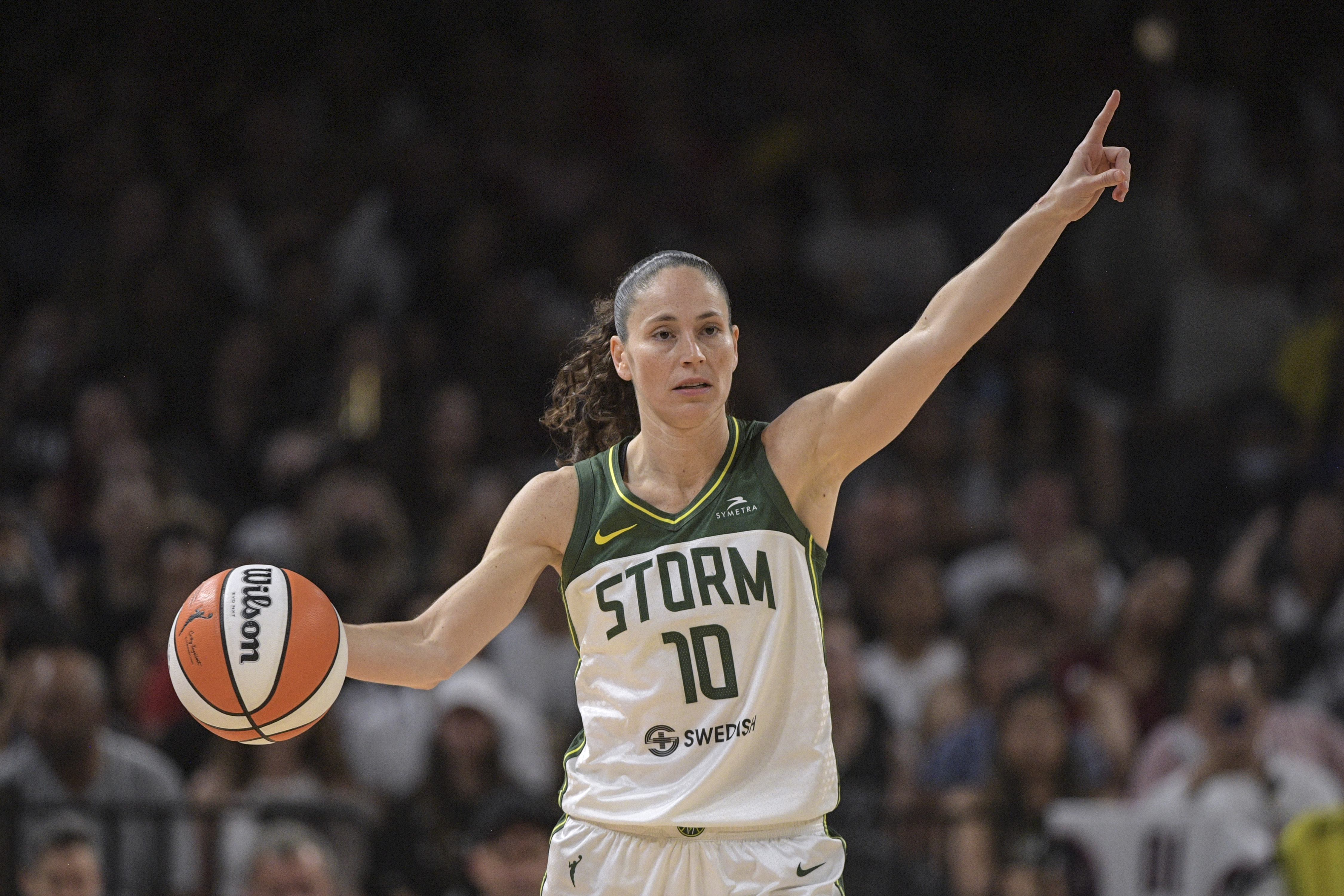 FILE - Seattle Storm guard Sue Bird (10) directs teammates during the second half of a WNBA game against the Las Vegas Aces, Sunday, Aug. 14, 2022, in Las Vegas. When opponents and teammates alike read off the skills that have separated Sue Bird into being one of the best, her mind and the way she sees the game is at the top of the list. That skill of being a coach on the court will be tested when the fourth-seeded Seattle Storm face No. 1 seed Las Vegas in the WNBA semifinals.