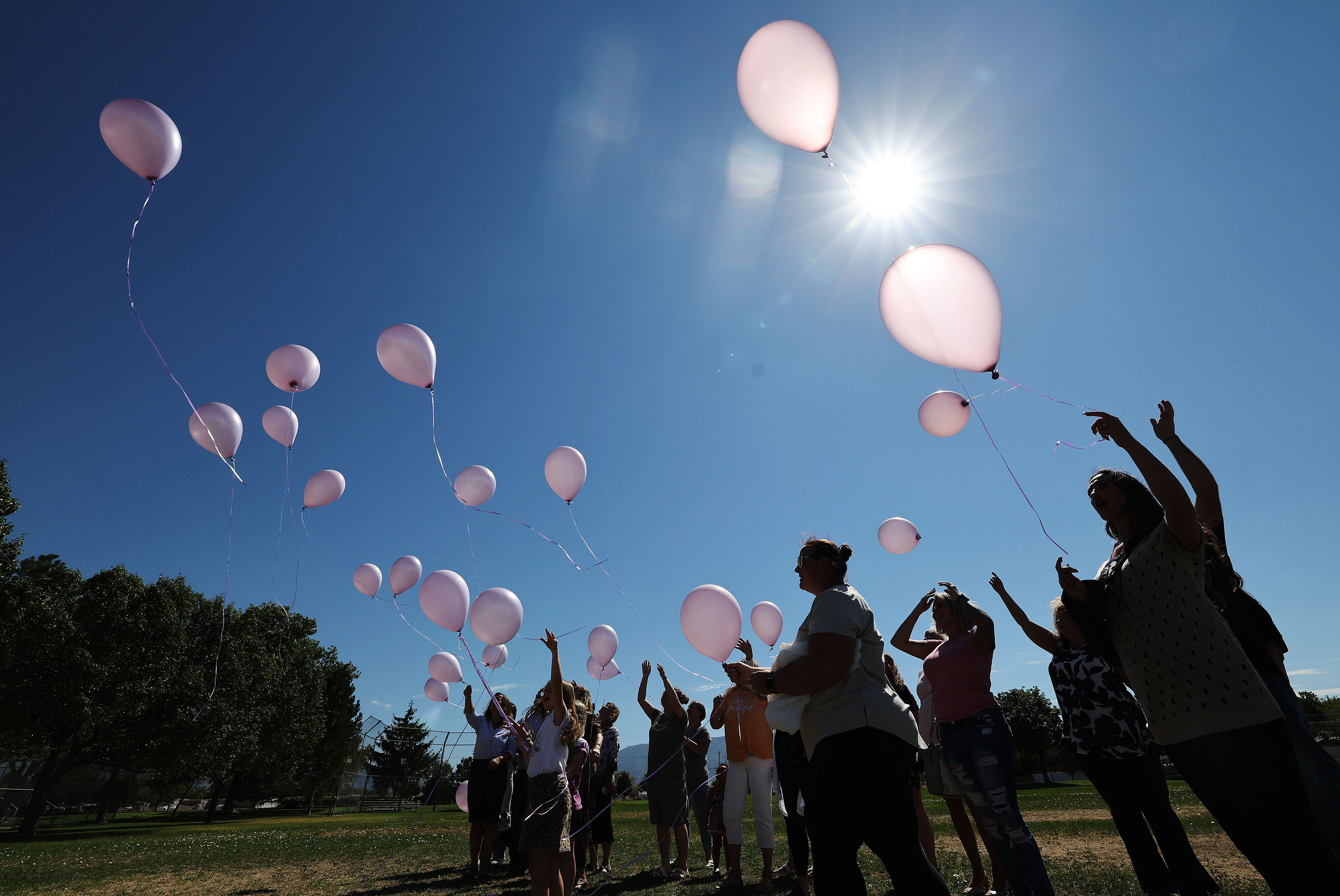 Balloons are released into the air in honor of Rachael Runyan, who was kidnapped and murdered in 1982, during a Missing and Exploited Children’s Day event at Rachael Runyan Memorial Park in Sunset on Friday.