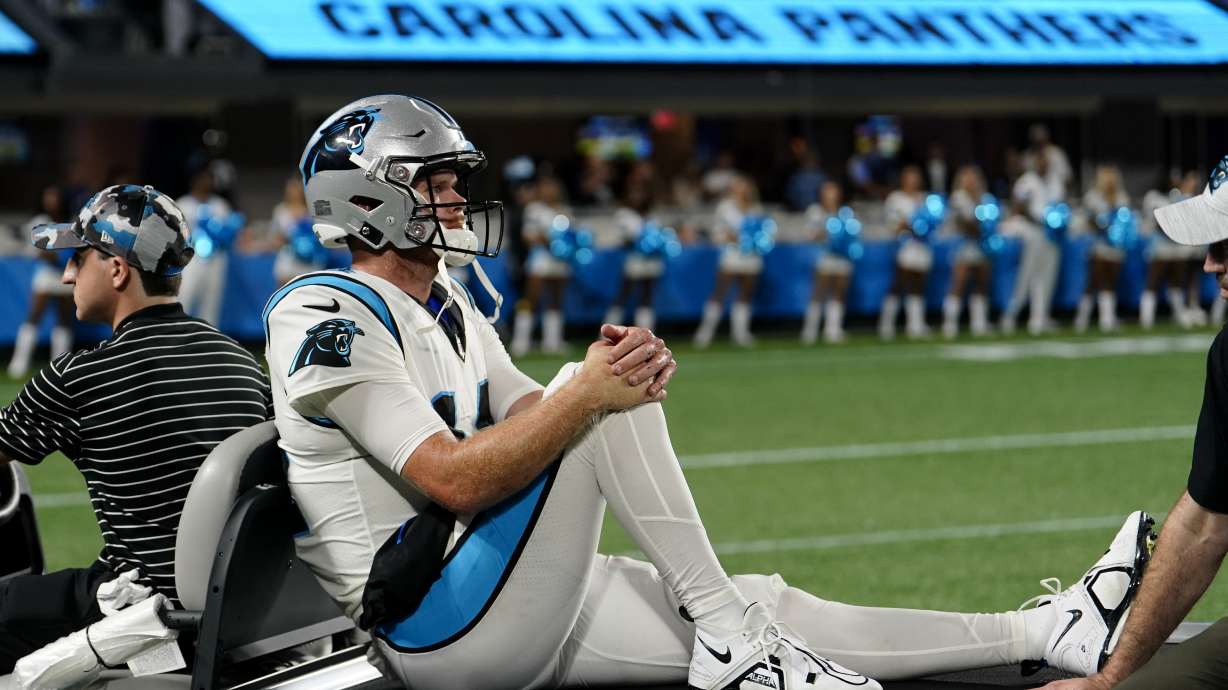 Carolina Panthers quarterback Sam Darnold leaves the field on a cart after getting injured during the second half of an NFL preseason football game against the Buffalo Bills on Friday, Aug. 26, 2022, in Charlotte, N.C.