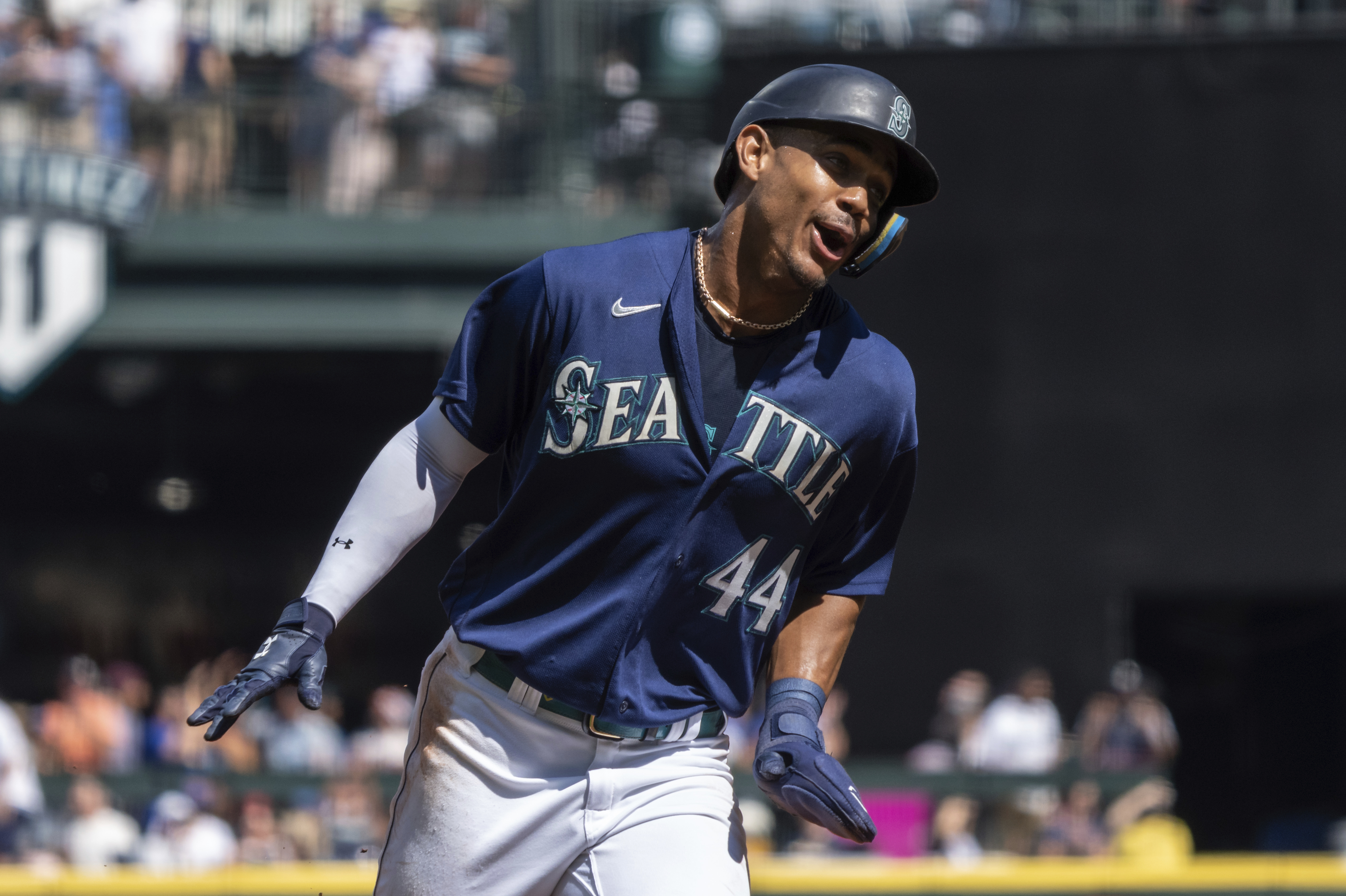 Seattle Mariners' Julio Rodriguez celebrates while rounding the bases a three-run home run by Mitch Haniger during the first inning a baseball game against the Cleveland Guardians, Thursday, Aug. 25, 2022, in Seattle. 