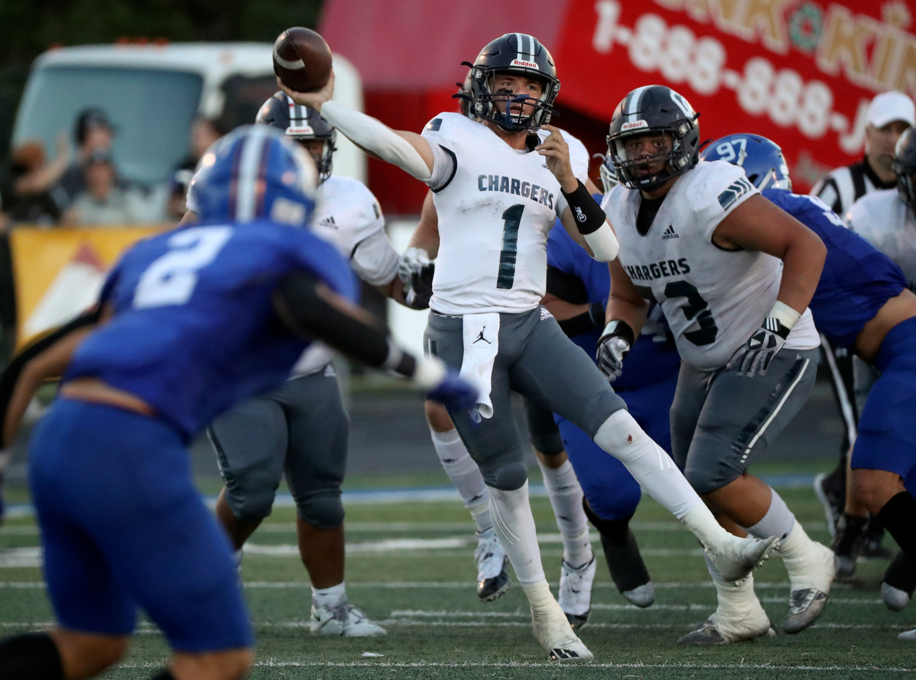 Corner Canyon quarterback Isaac Wilson attempts a pass as Corner Canyon plays Bingham in a varsity football game at Bingham High School in South Jordan on Friday, Aug. 26, 2022. Corner Canyon won 38-28.