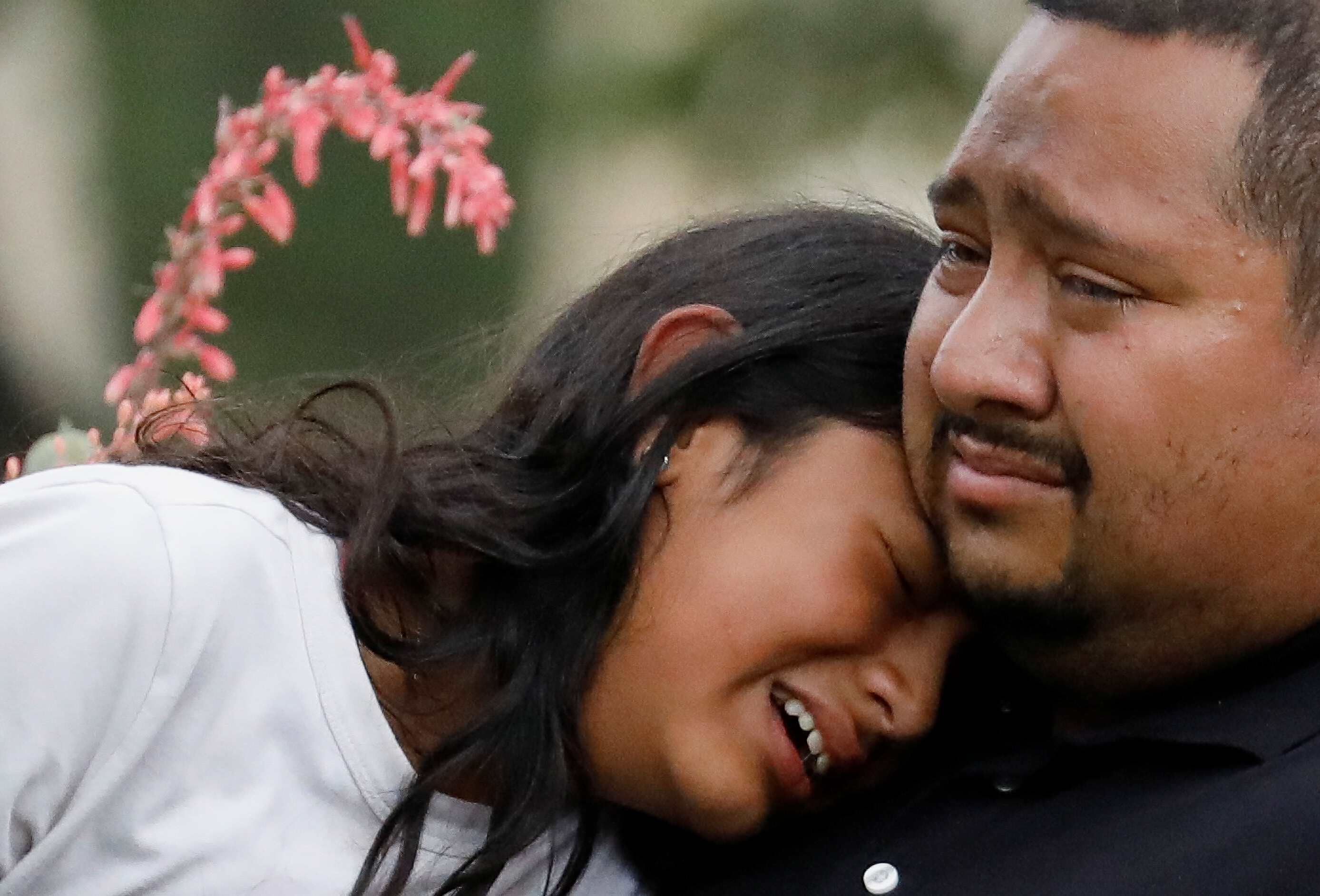 People cry May 24 outside a civic center where students were taken from Robb Elementary.