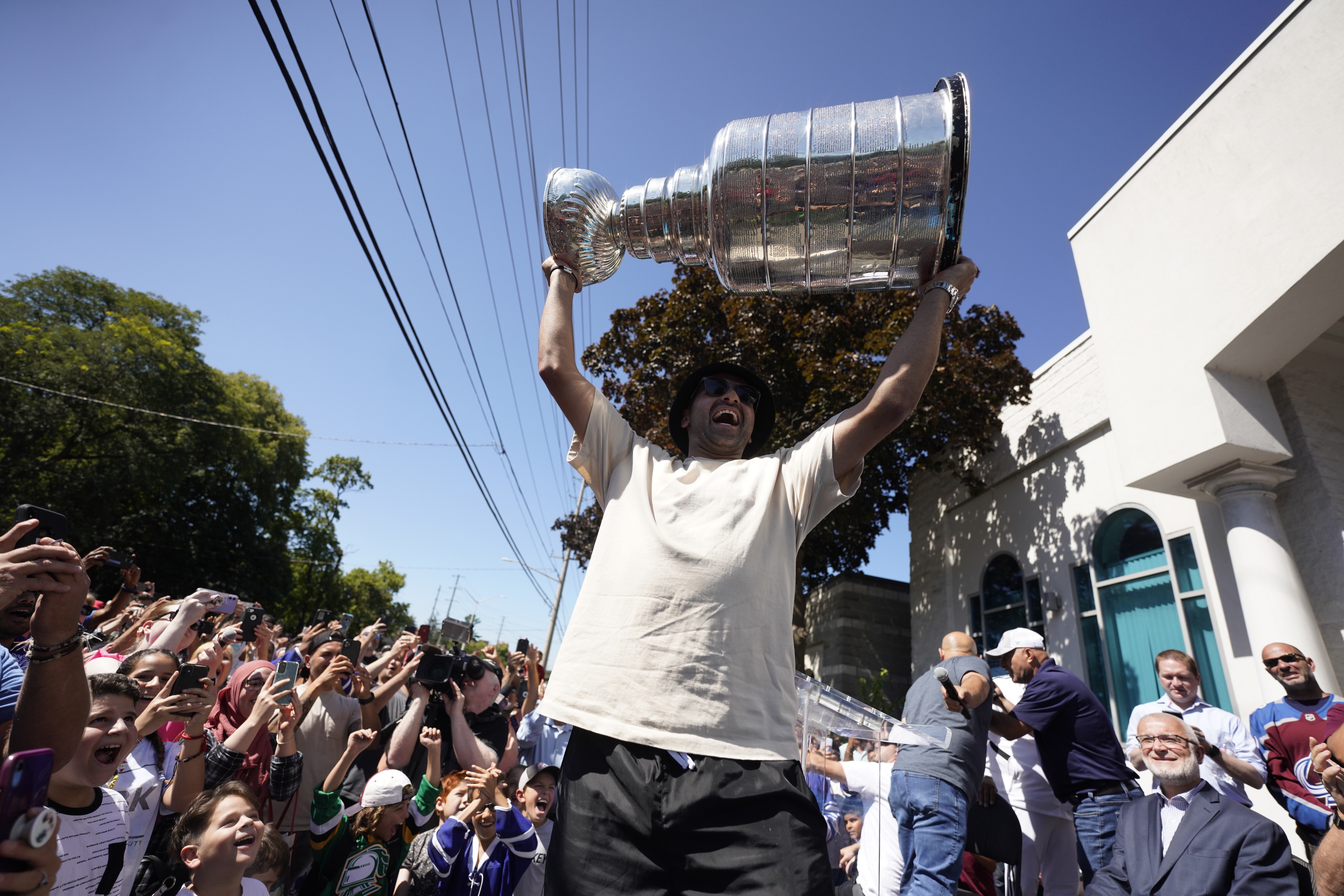 NHL player Nazem Kadri hoist the Stanley Cup in front of the London Muslim Mosque in London, Ontario on Saturday Aug. 27, 2022. Kadri, 31, won the cup for the first time while playing with the Colorado Avalanche.