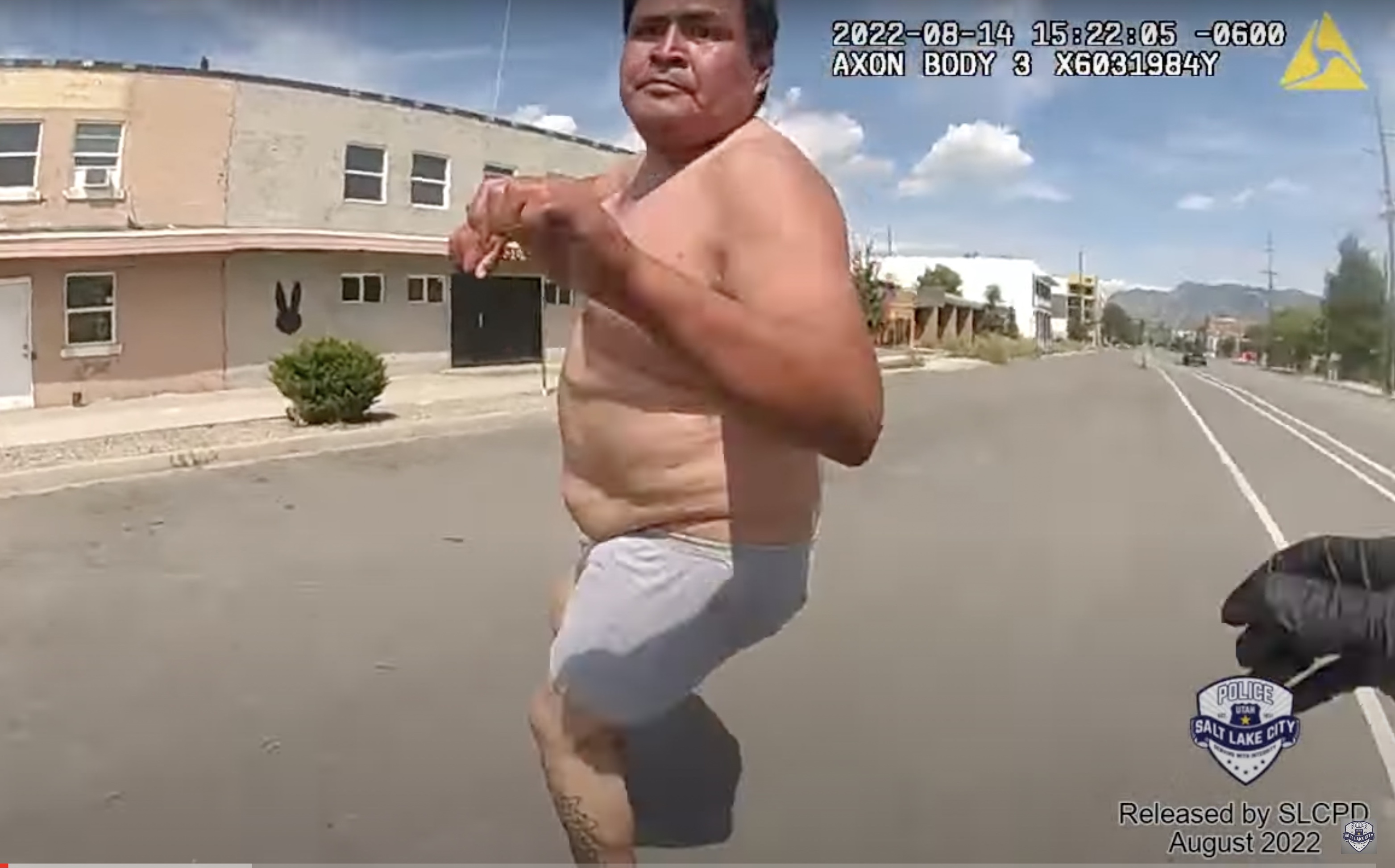 A man who died after being placed into police custody repeatedly struggled with officers and even attempted to grab an officer's gun, according to newly-released police body camera videos.