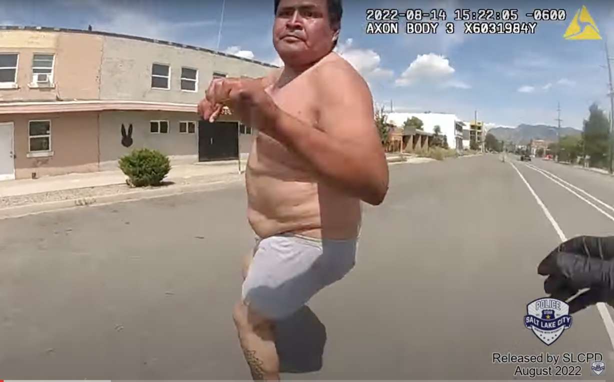 A man who died after being placed into police custody repeatedly struggled with officers and even attempted to grab an officer's gun, according to newly-released police body camera videos.