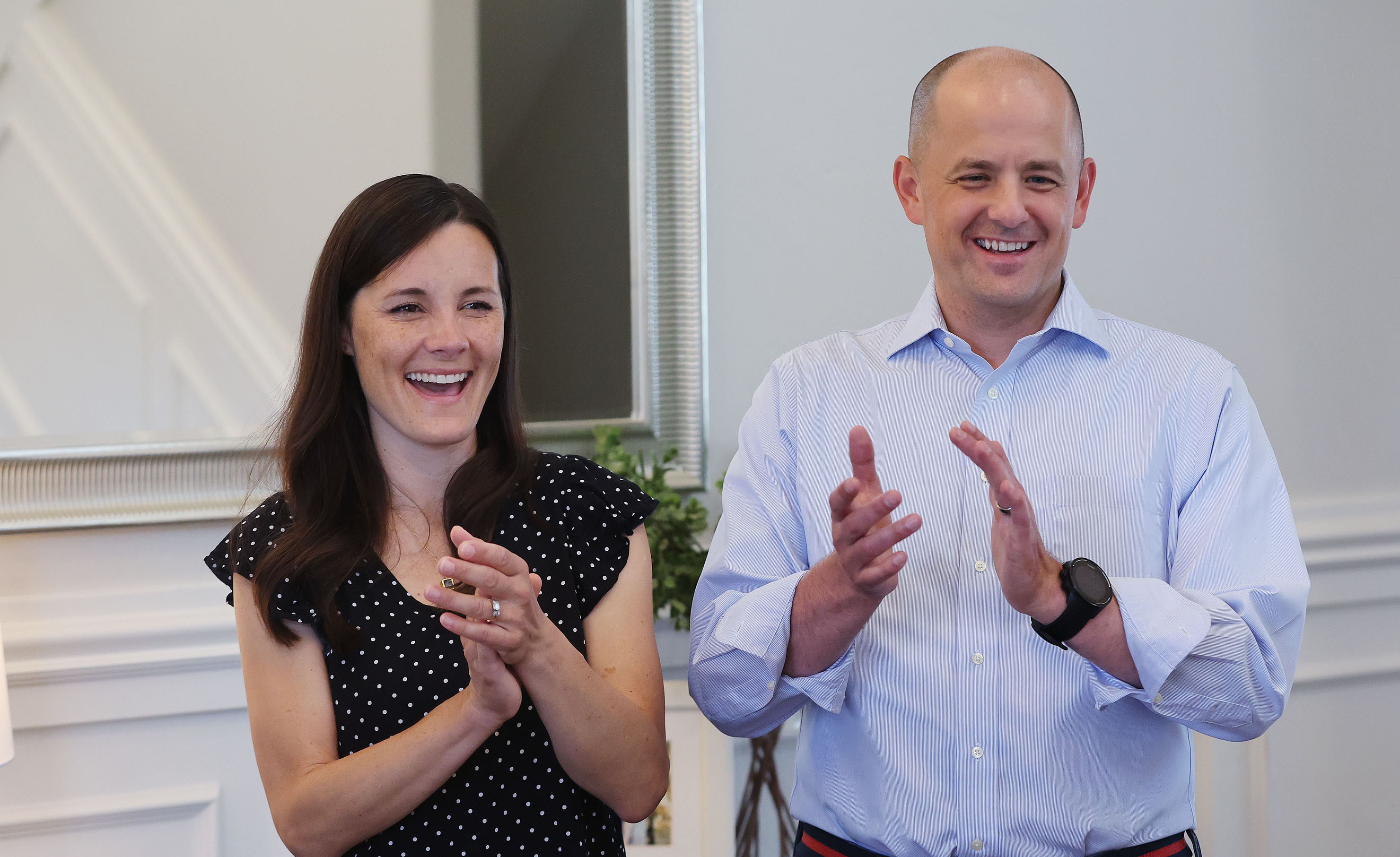 Emily McMullin, left, and her husband, Evan, applaud a piano performance by their children at their home in Highland on Aug. 5. Evan McMullin is running for U.S. Senate. The McMullins were threatened by an armed man after a campaign event in southern Utah in April, court documents say.