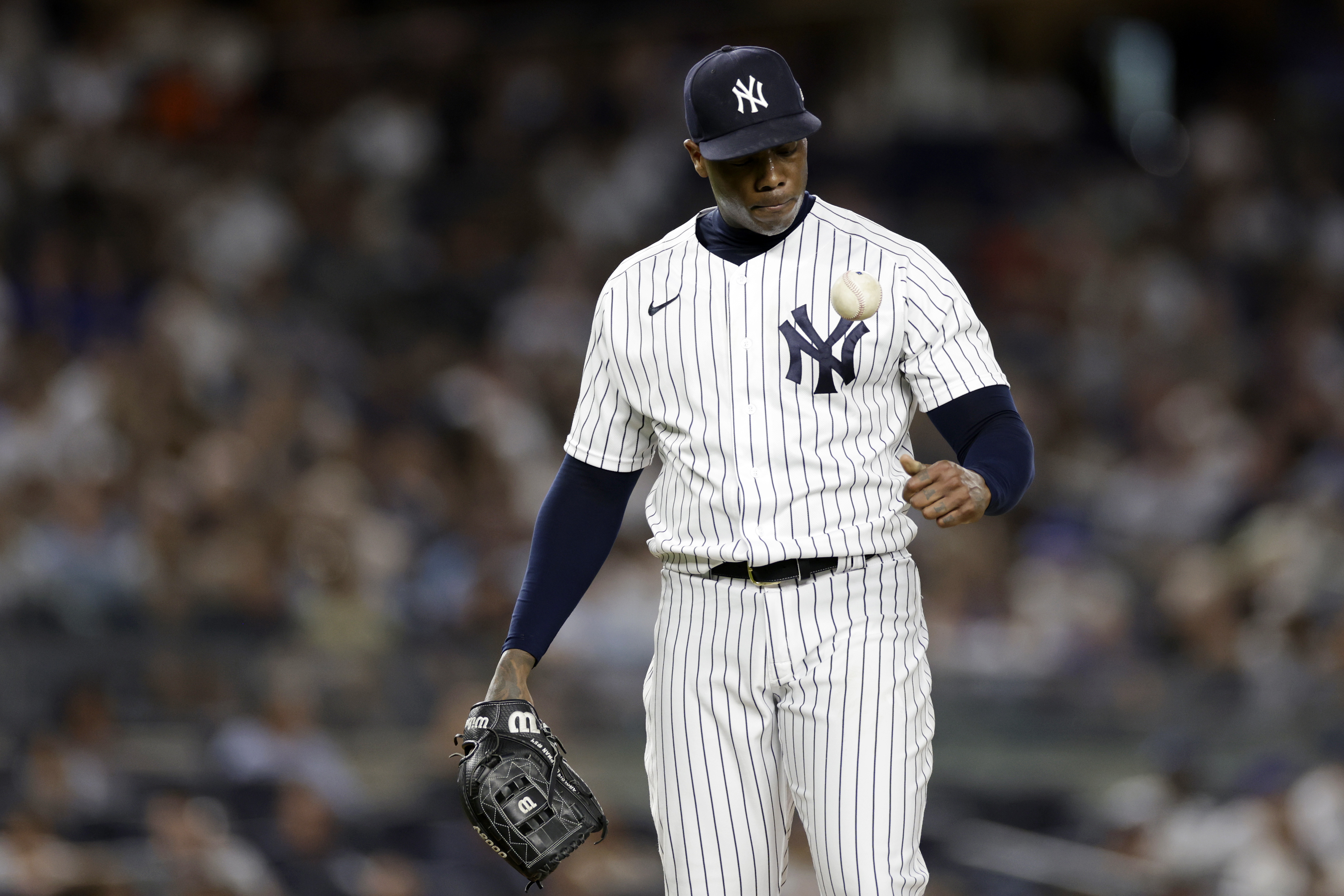New York Yankees pitcher Aroldis Chapman reacts while he waits to be taken out during the ninth inning of a baseball game against the Toronto Blue Jays, Friday, Aug. 19, 2022, in New York.