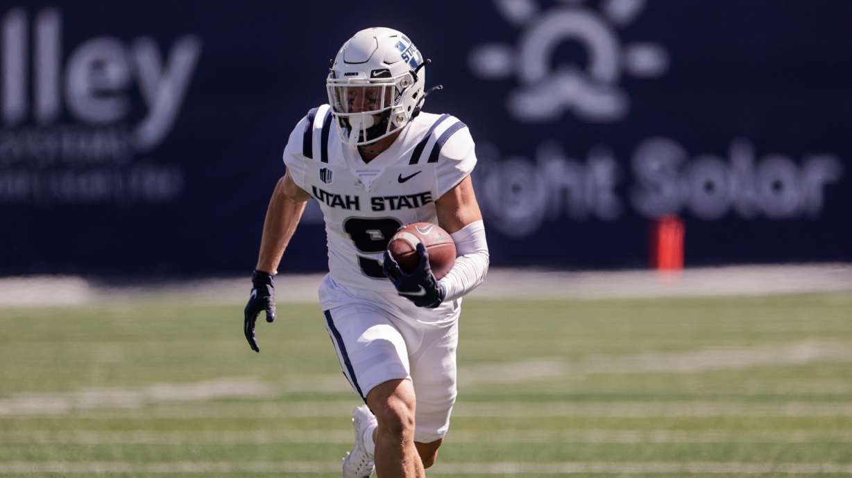 Kyle Van Leeuwen (9) from the Utah Aggies runs the ball down the field while playing the UConn Huskies at the Maverik Stadium in Logan on Saturday, Aug. 27, 2022. The Aggies won 31-20.