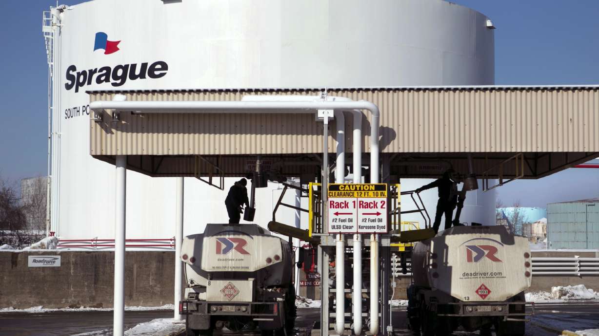Drivers for an oil delivery company fill their trucks at the Sprague terminal, on Jan. 16, 2014, in South Portland, Maine. Diesel and heating oil supplies in the Northeast are more than 50% below the recent average, raising concerns that an extreme weather event could cause supply disruptions, federal officials said.