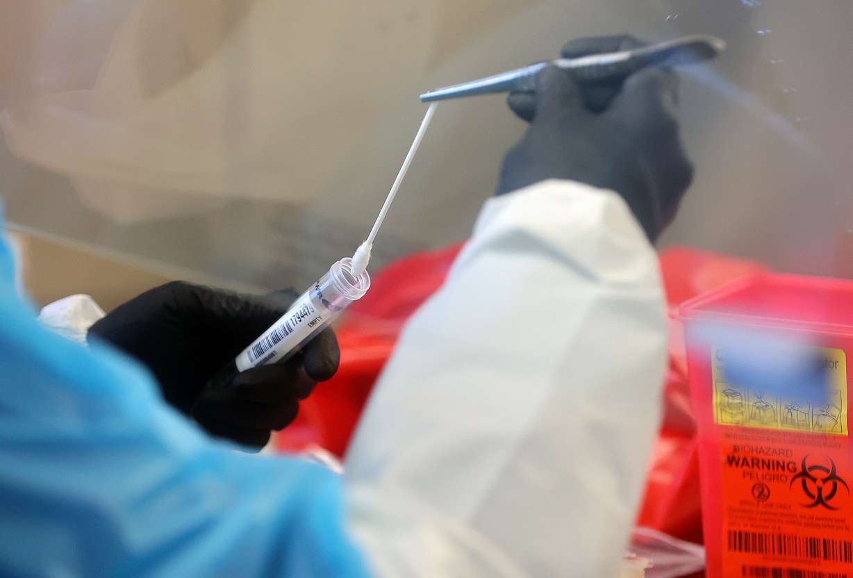 Annette Atkinson, Utah Public Health Laboratory infectious disease microbiologist, processes monkeypox test samples for DNA extraction at the Utah Public Health Laboratory in Taylorsville on Aug. 25.