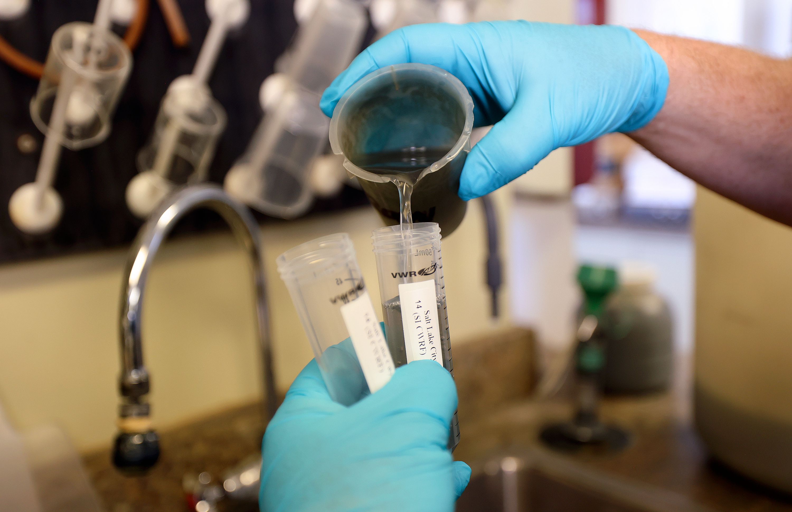 Jonathan Yonk, Salt Lake City Water Reclamation Facility senior chemist, collects a 24-hour composite sample of wastewater for COVID-19 testing at the Salt Lake City Water Reclamation Facility in Salt Lake City on Aug. 16.