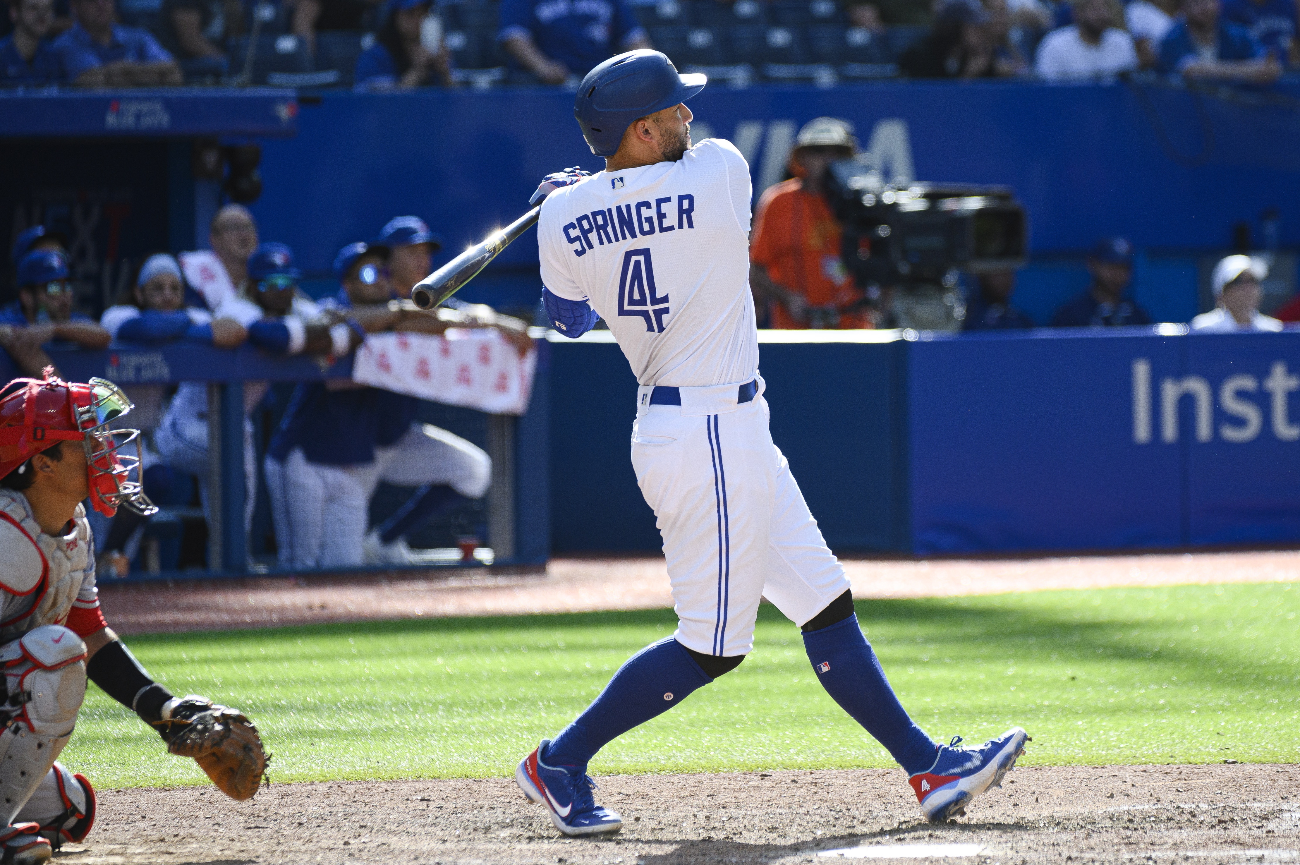 Toronto Blue Jays' George Springer (4) hits a solo home run in the ninth inning of a baseball game against the Los Angeles Angels, in Toronto on Sunday, Aug. 28, 2022. 
