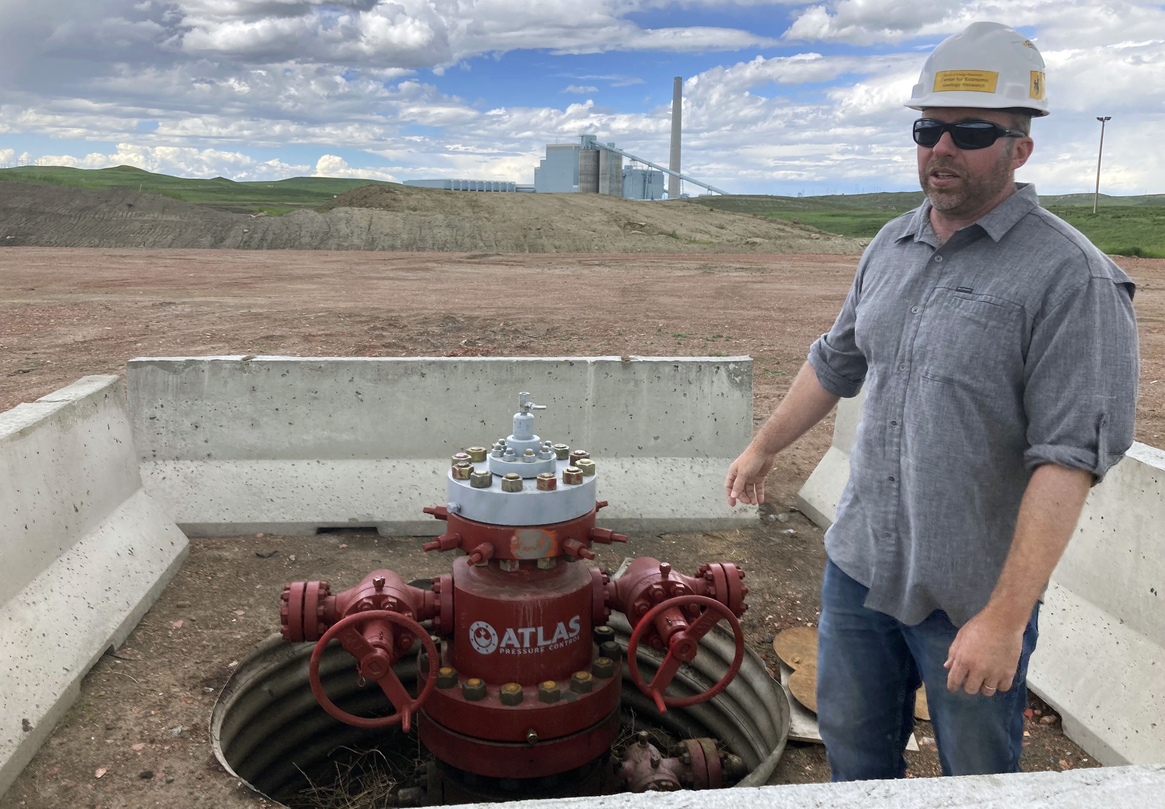 Fred McLaughlin, director of the Center for Economic Geology Research at the University of Wyoming, stands near one of two wells drilled near the Dry Fork Station coal-fired power plant outside Gillette, Wyo., on June 14. McLaughlin and other researchers are studying whether formations as deep as 10,000 feet can be used to store the power plant’s carbon dioxide emissions.