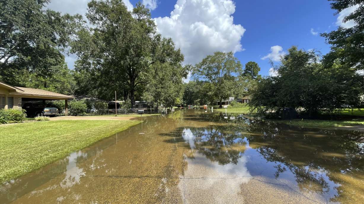 Floodwaters covered the streets in some parts of the North Canton Circle neighborhood of Jackson, Miss., on Monday.