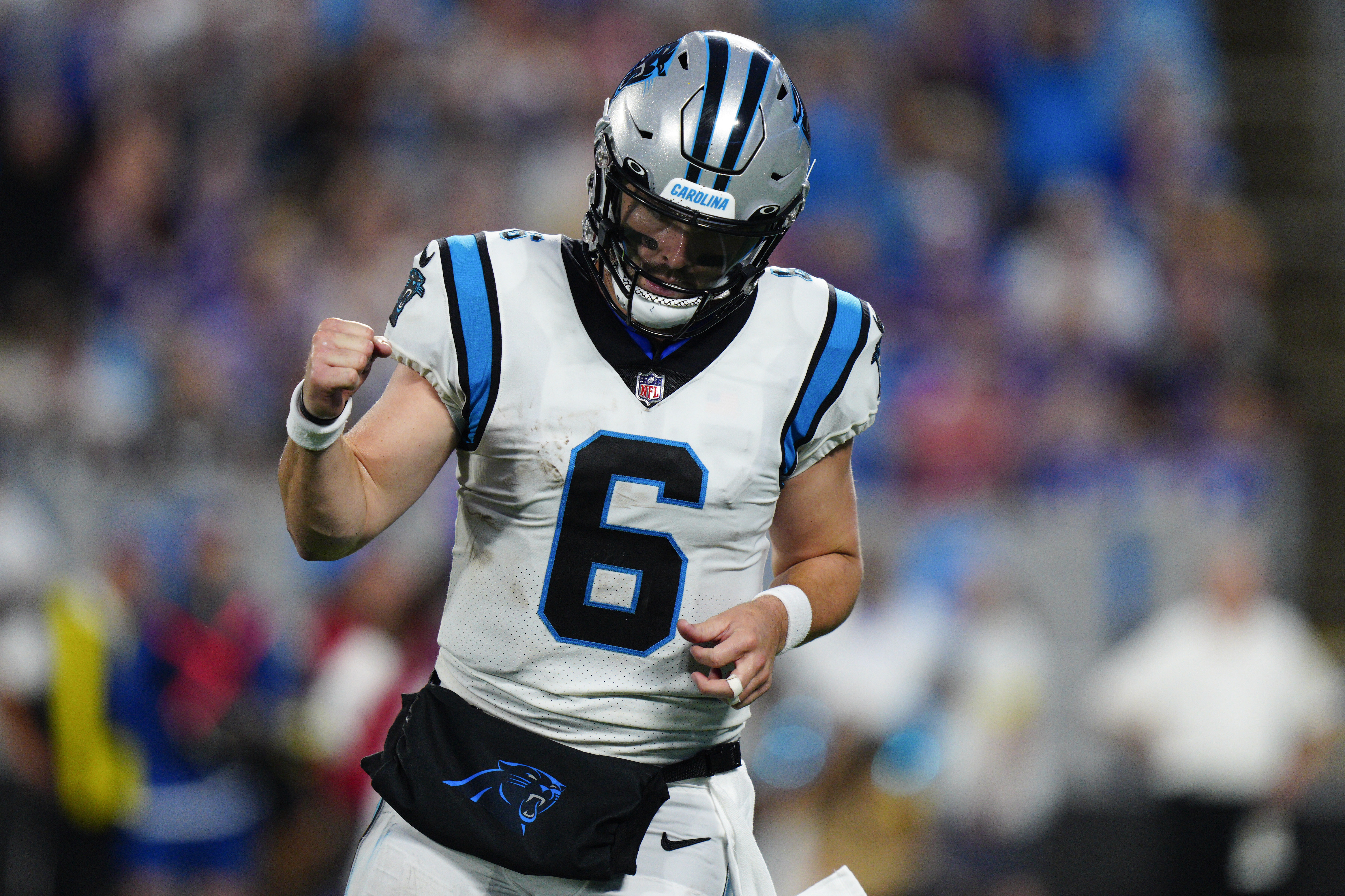 Carolina Panthers quarterback Baker Mayfield celebrates after throwing a touchdown pass against the Buffalo Bills during the first half of an NFL preseason football game on Friday, Aug. 26, 2022, in Charlotte, N.C. 