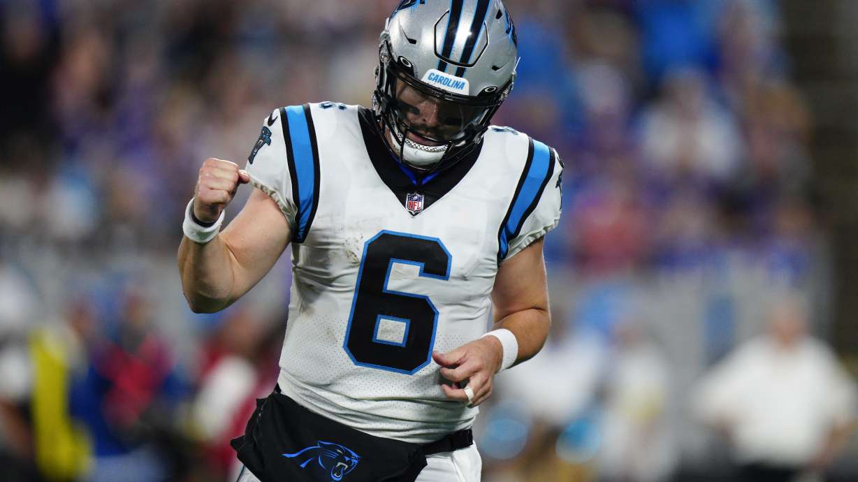Carolina Panthers quarterback Baker Mayfield celebrates after throwing a touchdown pass against the Buffalo Bills during the first half of an NFL preseason football game on Friday, Aug. 26, 2022, in Charlotte, N.C.
