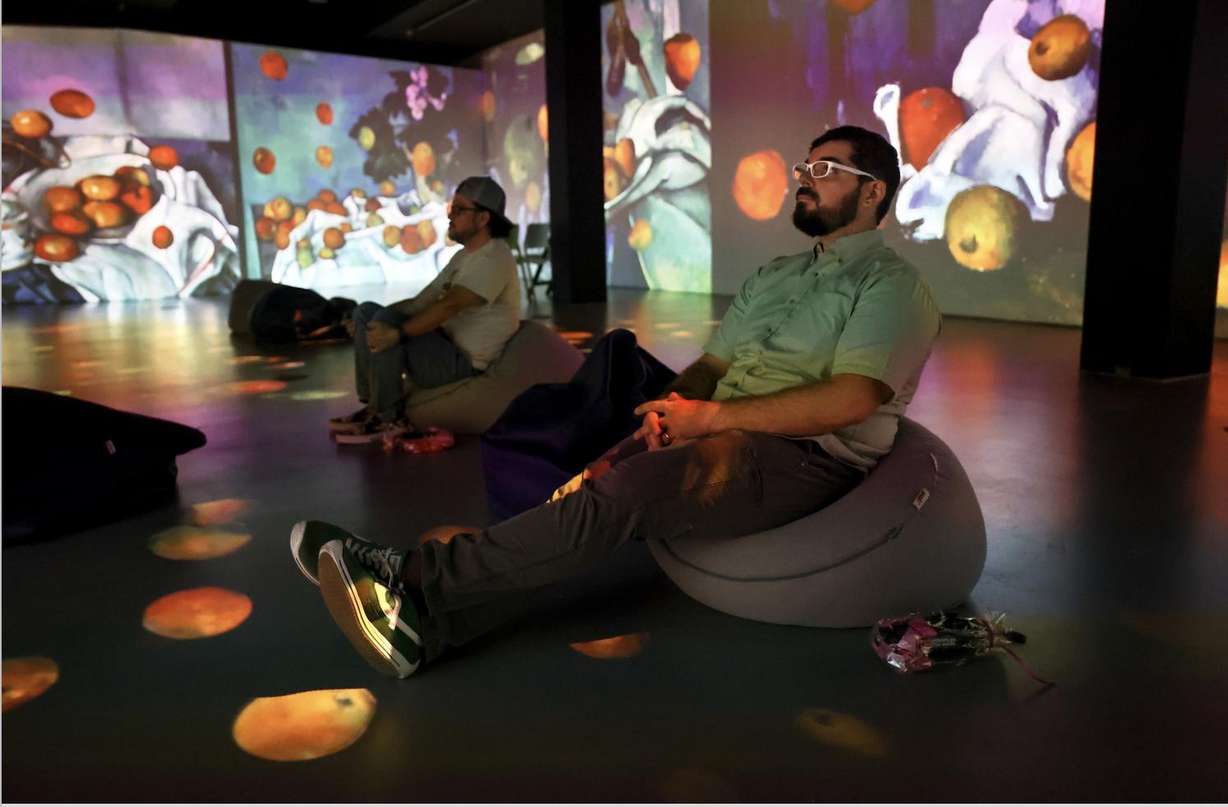 Horacio Rodriquez and Peter Hay watch "From Monet to Kandinsky," an immersive experience offered with Spanish narration, at The Leonardo in Salt Lake City on Tuesday.