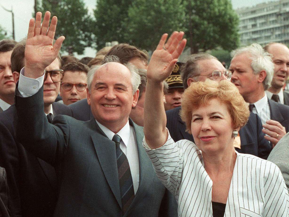 Soviet President Mikhail Gorbachev and his wife Raisa wave to a crowd during their visit in Paris, France, Wednesday, July 5, 1989.
