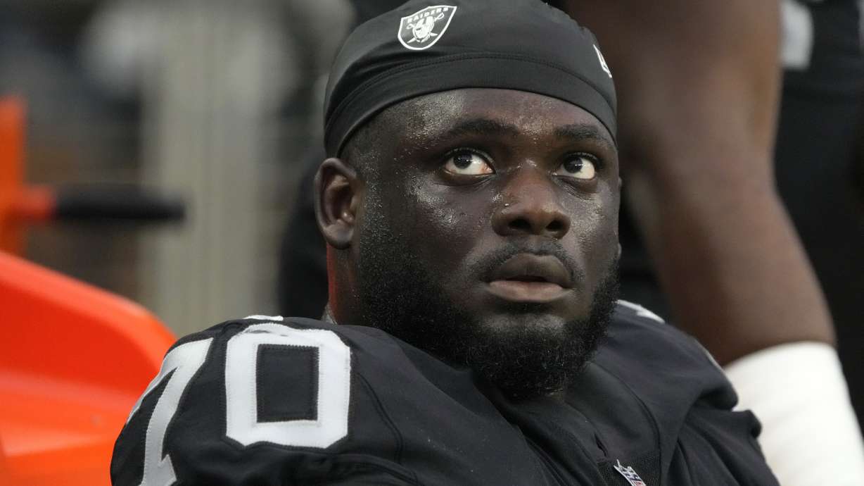 FILE - Las Vegas Raiders offensive tackle Alex Leatherwood looks up during the first half of the team's NFL preseason football game against the Minnesota Vikings on Aug. 14, 2022, in Las Vegas. The Raiders waived Leatherwood on Tuesday, Aug. 30, the third of the club's three first-round draft picks in 2020-21 to get dumped before the end of their second season.
