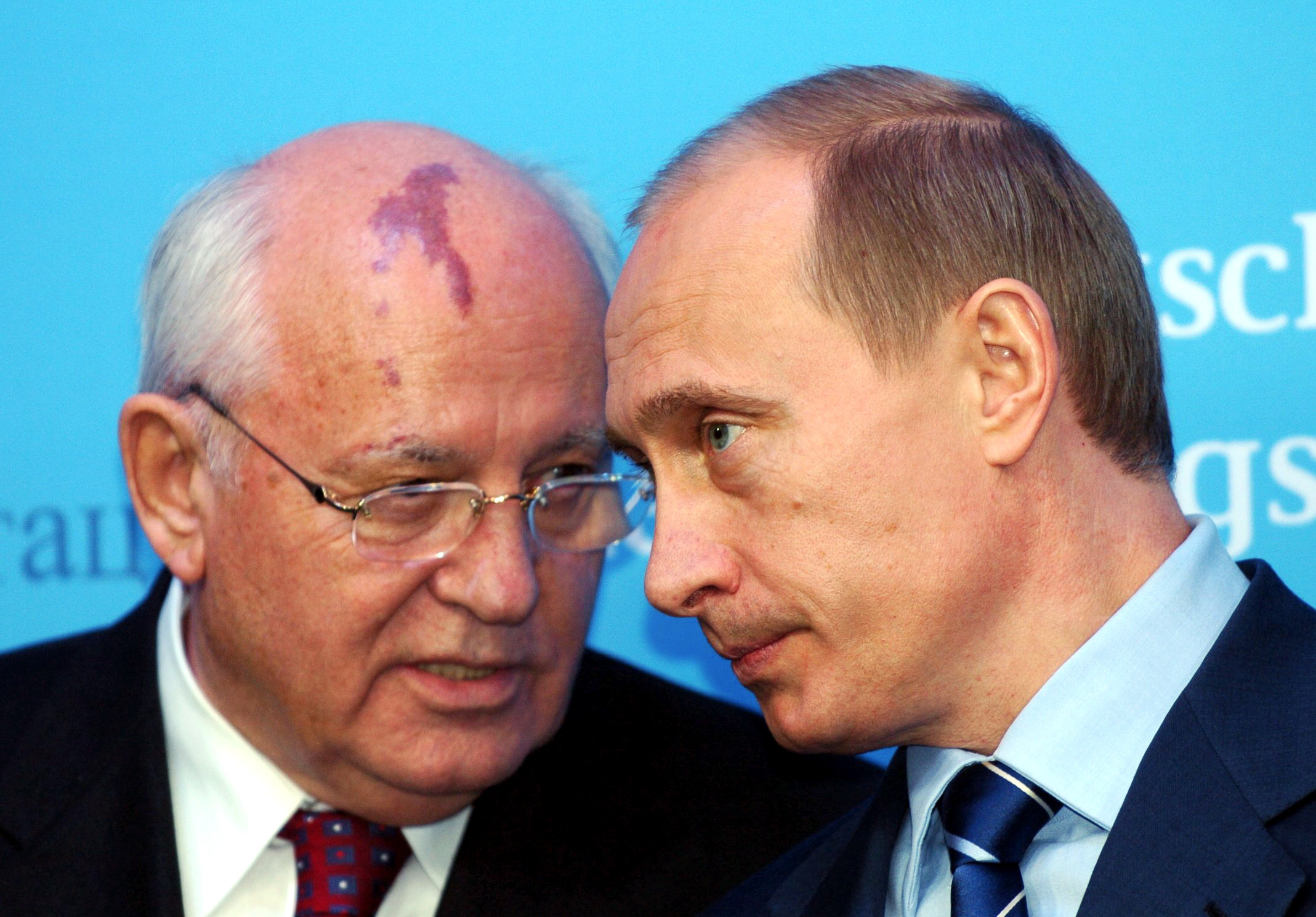 Russia's President Vladimir Putin, right, talks with former Soviet President Mikhail Gorbachev at the start of a news conference at the Castle of Gottorf in Schleswig, northern Germany, Dec. 21, 2004. Russian news agencies are reporting that former Soviet President Mikhail Gorbachev has died at 91. 