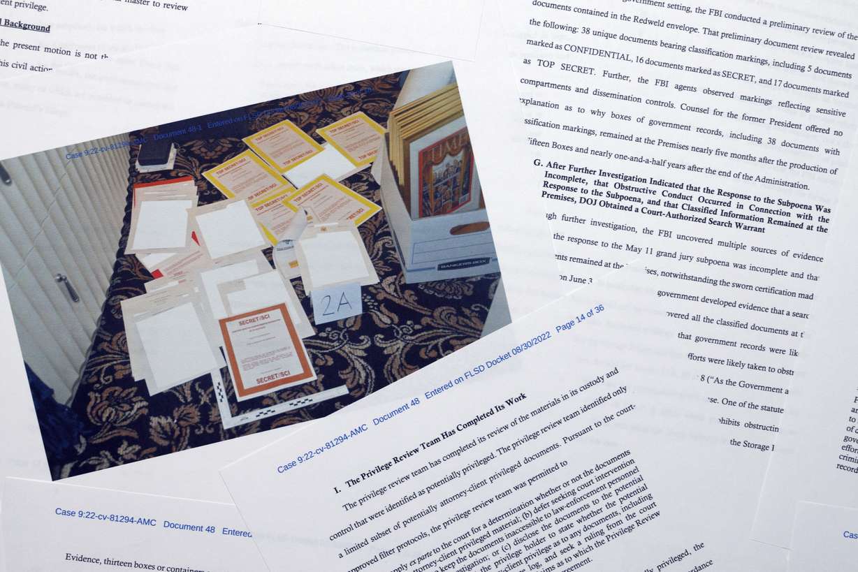 Pages from a Department of Justice court filing on Tuesday in response to a request from the legal team of former President Donald Trump for a special master to review the documents seized during the Aug. 8 search of Mar-a-Lago, are photographed early Wednesday.