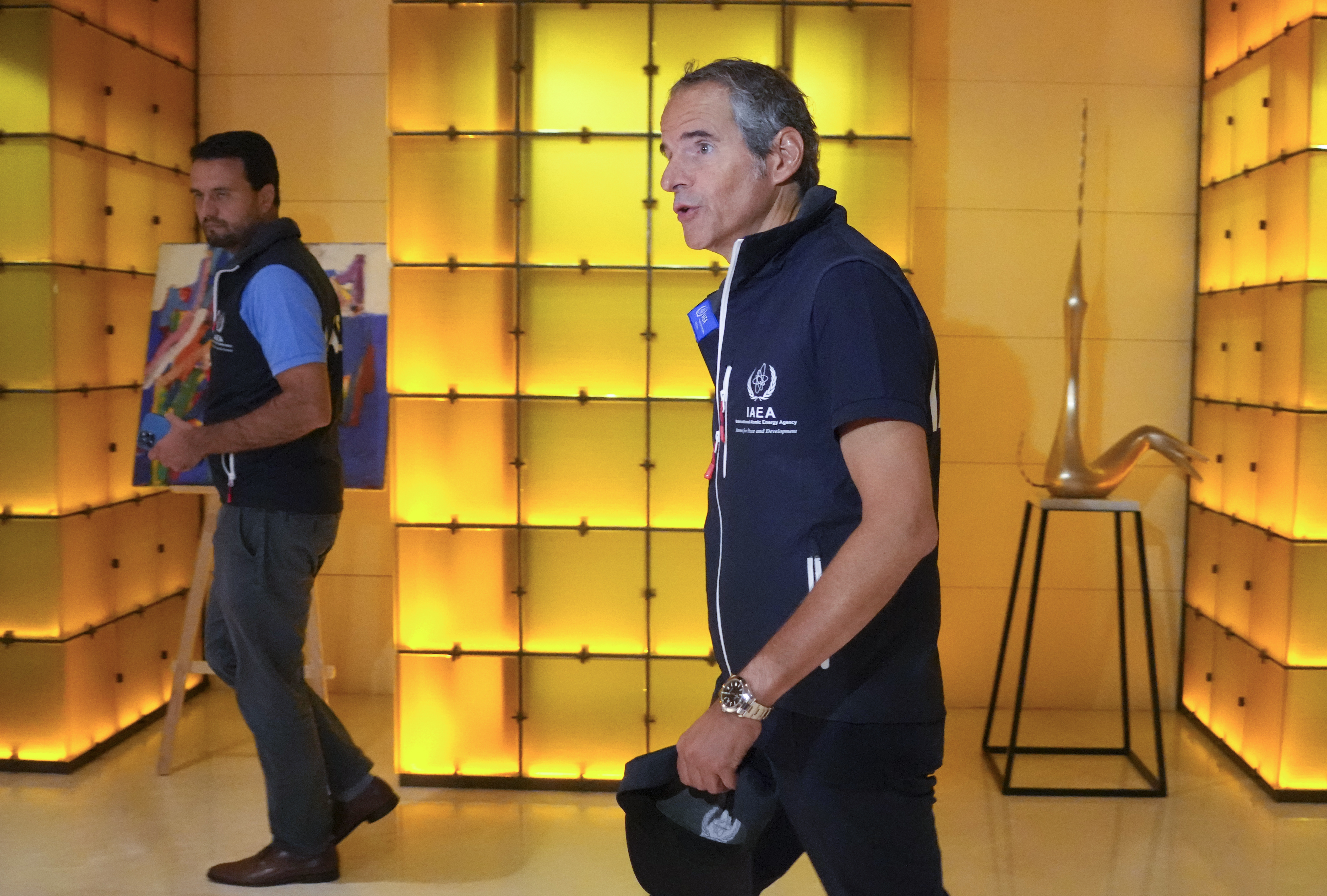 Director General of the International Atomic Energy Agency Rafael Mariano Grossi, right, walks in Kyiv, Ukraine, early Wednesday. The U.N. nuclear watchdog team set off on an urgent mission to safeguard the Russian-occupied Zaporizhzhia atomic power plant at the heart of fighting in Ukraine, a long-awaited trip the world hopes will help avoid a radioactive catastrophe.