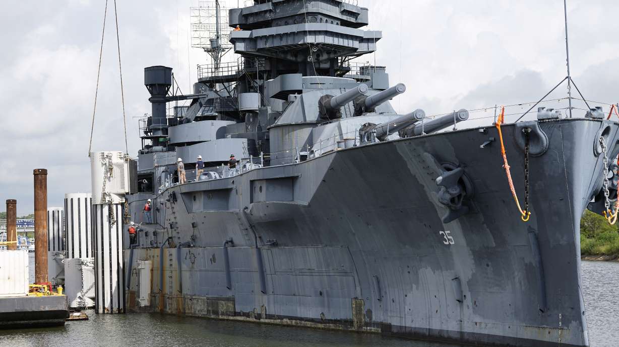 Preparations for moving the USS Texas continue Tuesday, in La Porte, Texas. The vessel, which was commissioned in 1914 and served in both World War I and World War II, is scheduled to be towed down the Houston Ship Channel Wednesday to a dry dock in Galveston where it will undergo an extensive $35 million repair.