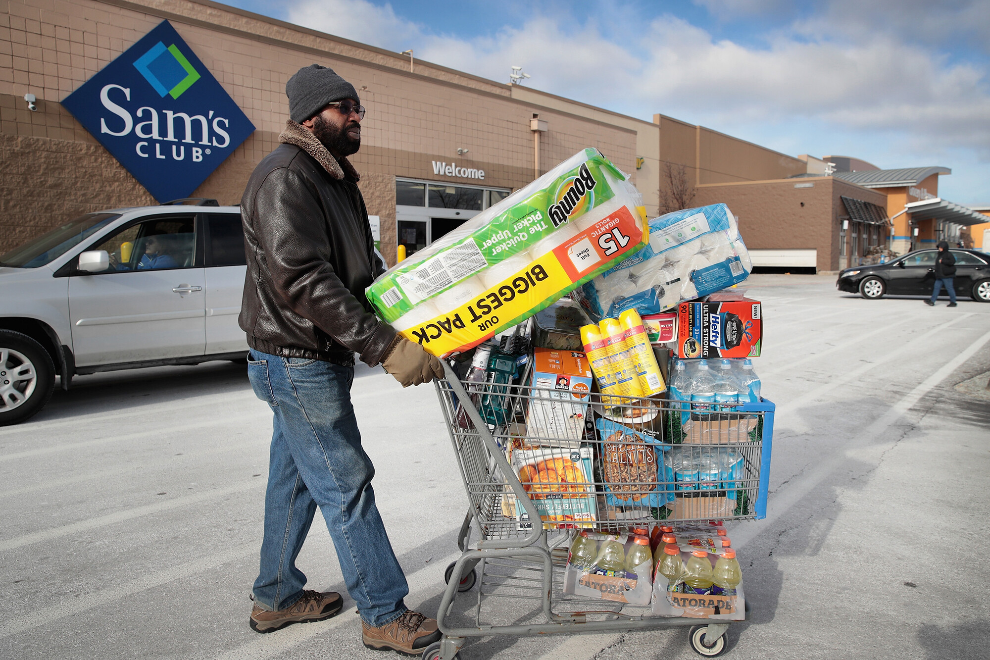 A shopper stocks up on merchandise at a Sam's Club store on January 12, 2018 in Streamwood, Illinois. The warehouse club, owned by Walmart, announced that it's raising its annual membership fee by 11% — from $45 to $50 — beginning in October.