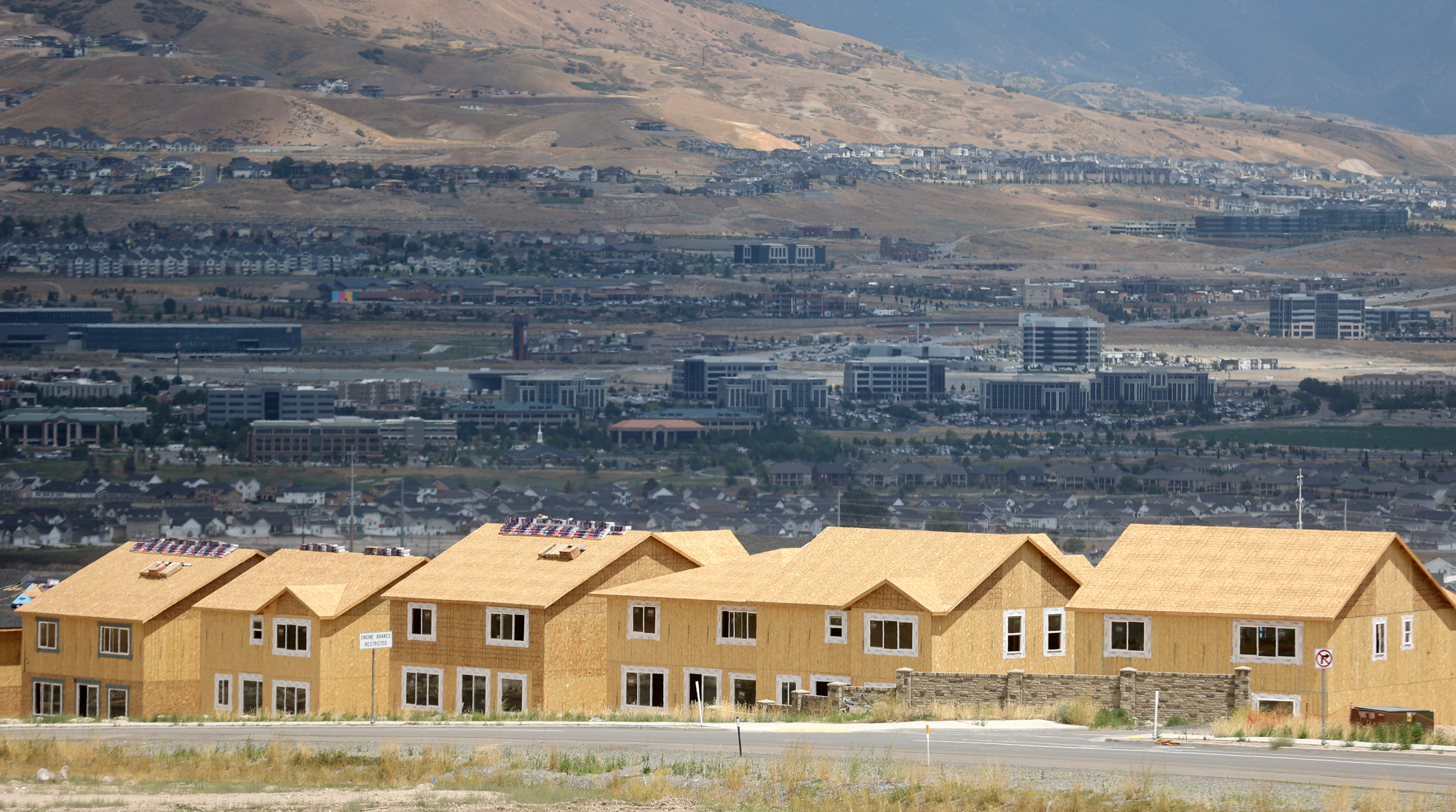 Single-family homes under construction in the Wildflower community in Saratoga Springs are pictured on July 19. Goldman Sachs released a report Tuesday predicting new home sales would drop by 22% this year, while existing home sales will fall by 17% during the same time period.
