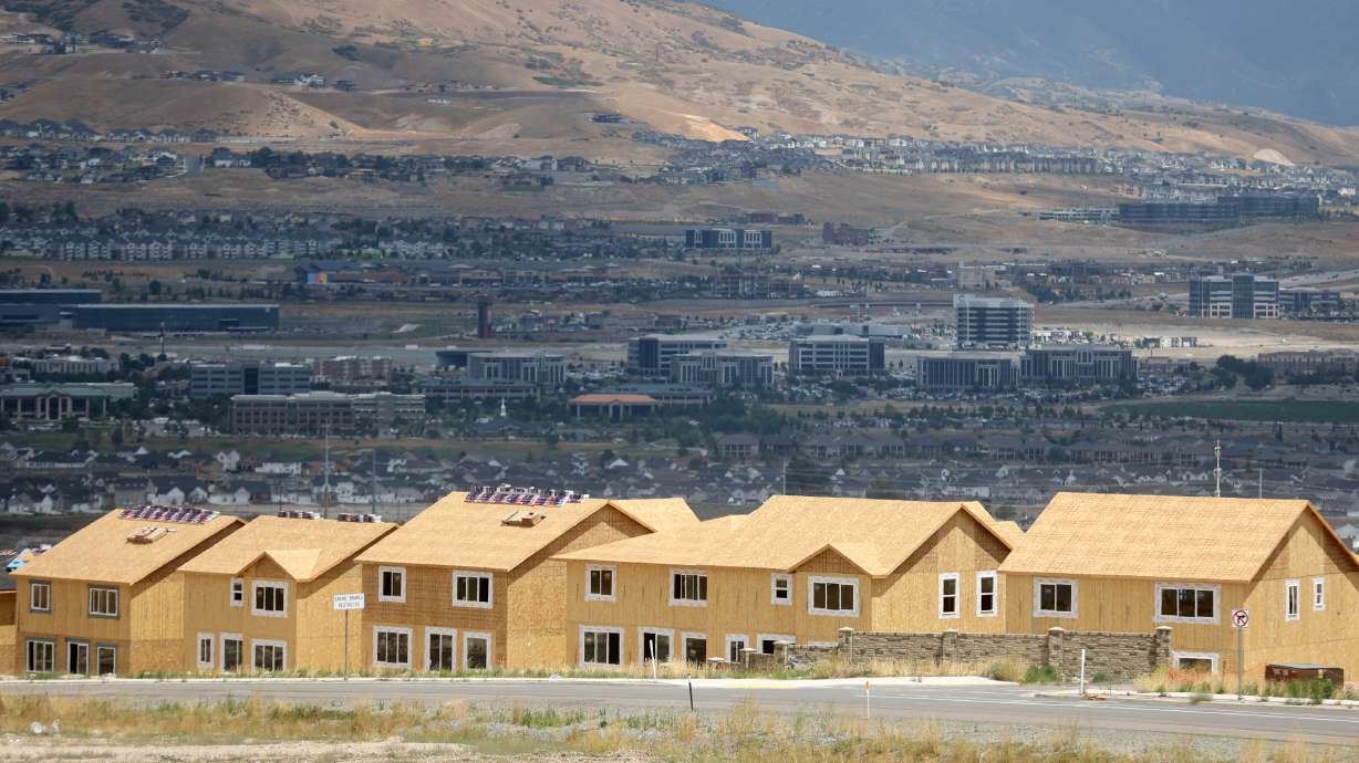 Single-family homes under construction in the Wildflower community in Saratoga Springs are pictured on July 19. Goldman Sachs released a report Tuesday predicting new home sales would drop by 22% this year, while existing home sales will fall by 17% during the same time period.