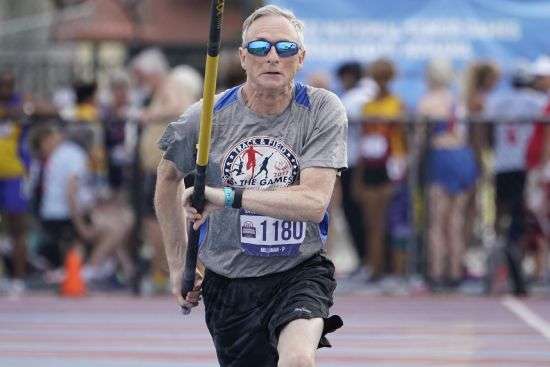Phil Milliman of Washington State, competes in the pole vault during the National Senior Games, May 16 in Miramar, Fla.