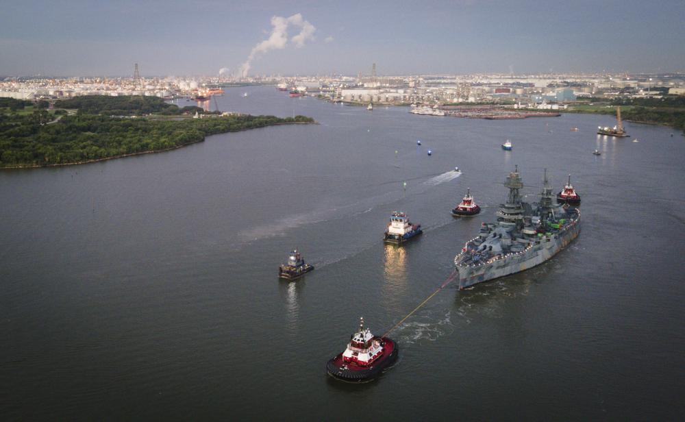 The USS Texas is towed into the Houston Ship Channel as it makes its way to Galveston for repairs, Wednesday in La Porte, Texas. The ship, which fought in both world wars, is making the journey to a dry dock in Galveston, where it will undergo an extensive $35 million repair.