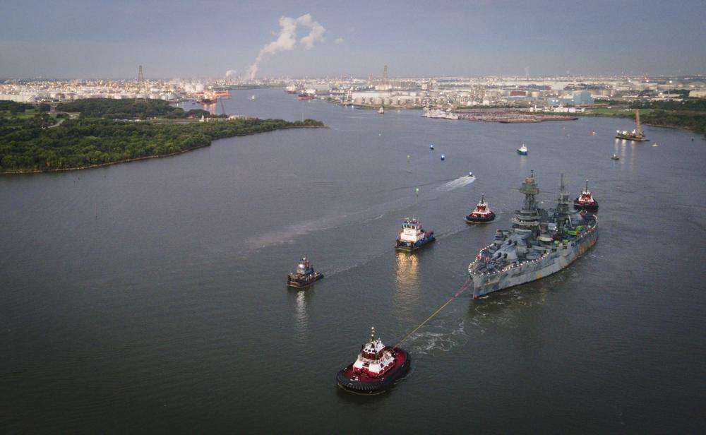 The USS Texas is towed into the Houston Ship Channel as it makes its way to Galveston for repairs, Wednesday in La Porte, Texas. The ship, which fought in both world wars, is making the journey to a dry dock in Galveston, where it will undergo an extensive $35 million repair.