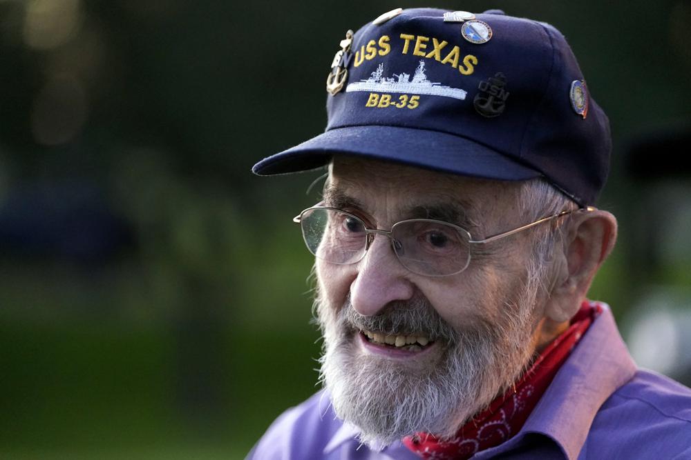 Julio Zaccagni, who served on the USS Texas from 1940 to 1942, watches as the battleship is moved, Wednesday, in La Porte, Texas. The vessel, which was commissioned in 1914 and served in both World War I and World War II, is being towed down the Houston Ship Channel to a dry dock in Galveston where it will undergo an extensive $35 million repair.