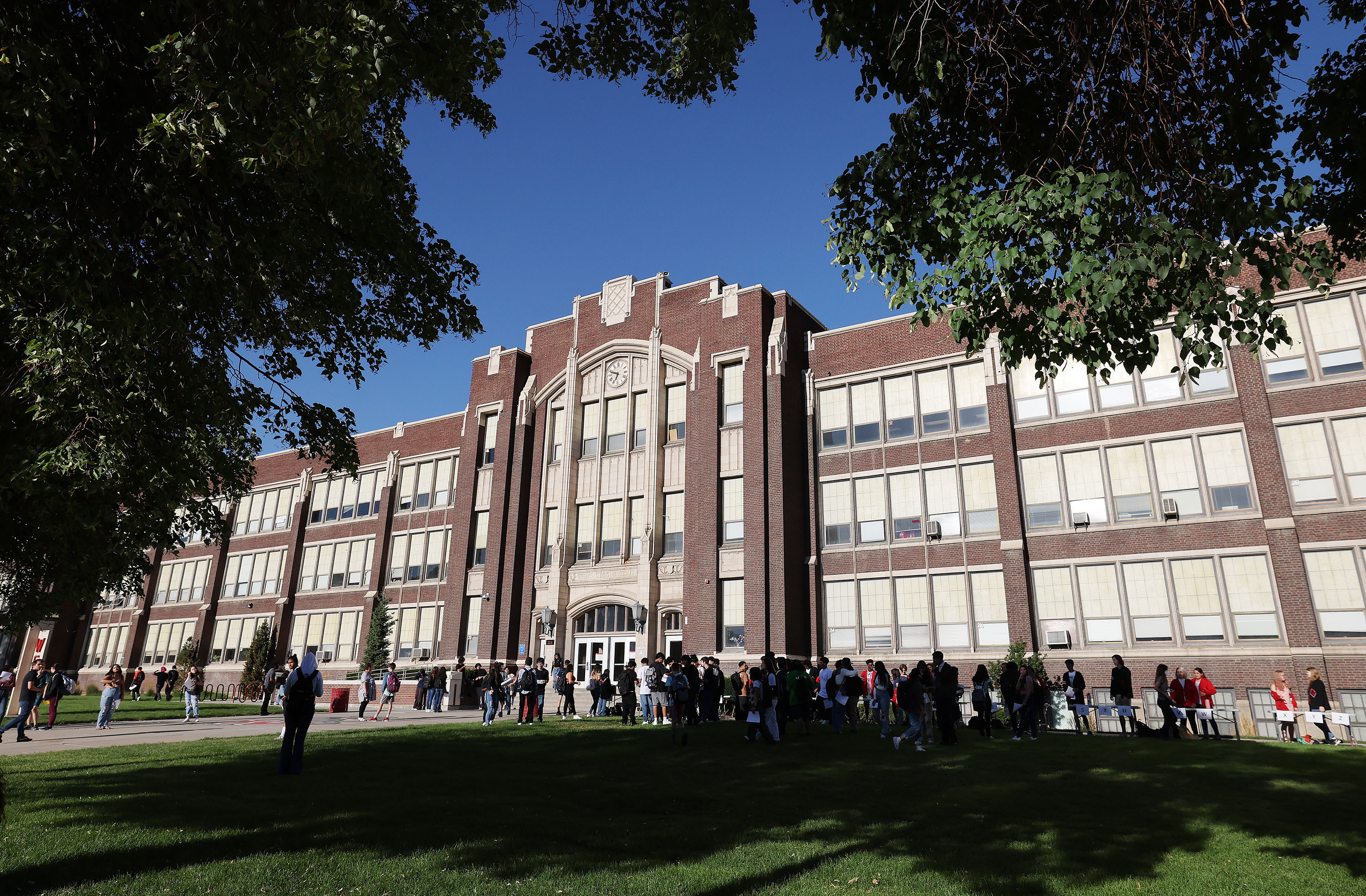 Students walk into West High School in Salt Lake City on Tuesday.  West High School has a little different take on how students should dress for school.