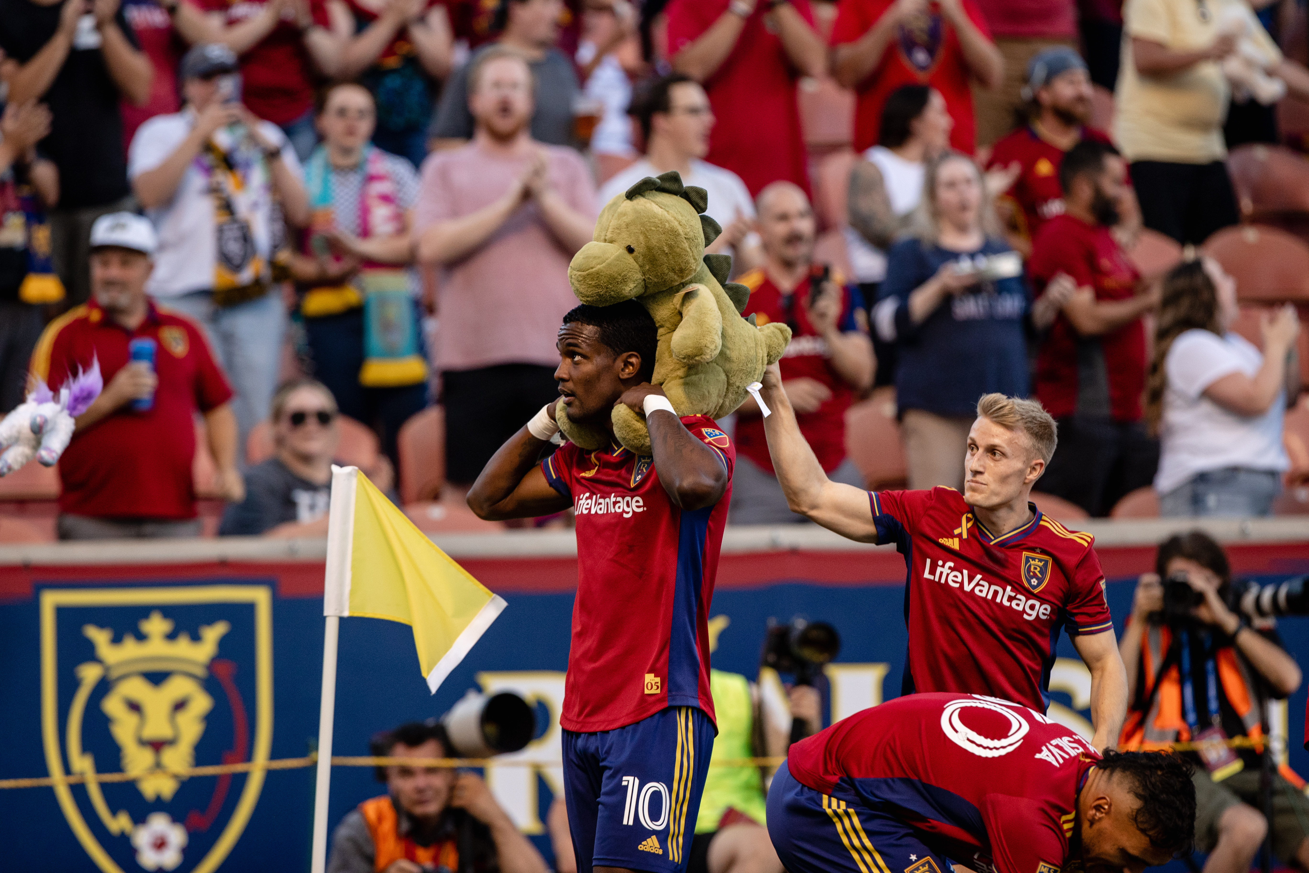Sergio Cordova celebrates a goal against Minnesota with a stuffed animal thrown on the field in honor of "Kick Childhood Cancer Night" at the RioT.