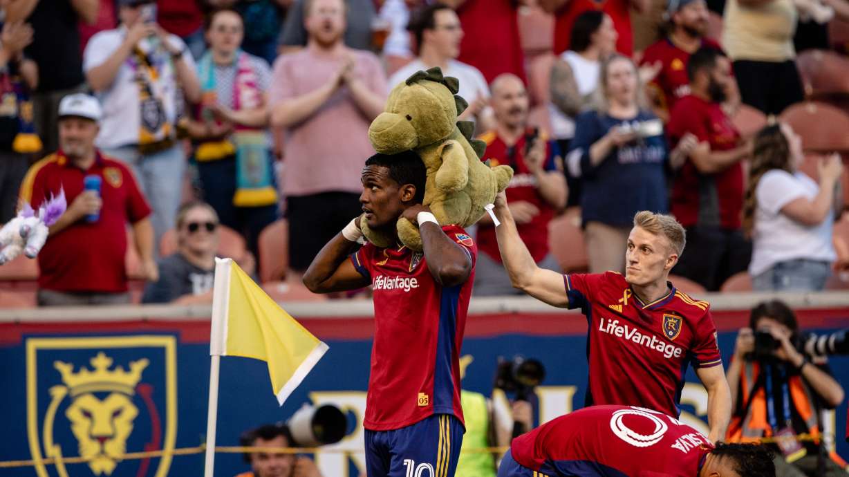 Sergio Cordova celebrates a goal against Minnesota with a stuffed animal thrown on the field in honor of "Kick Childhood Cancer Night" at the RioT.