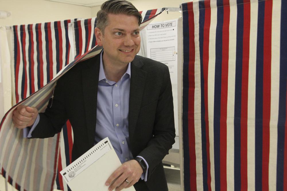 Nick Begich, a Republican candidate in both the special election and regular primary for Alaska's open U.S. House seat, emerges from a booth after voting Aug. 10 in Anchorage, Alaska. Democrat Mary Peltola won the special election for Alaska's only U.S. House seat on Wednesday, besting a field that included Republican Sarah Palin.