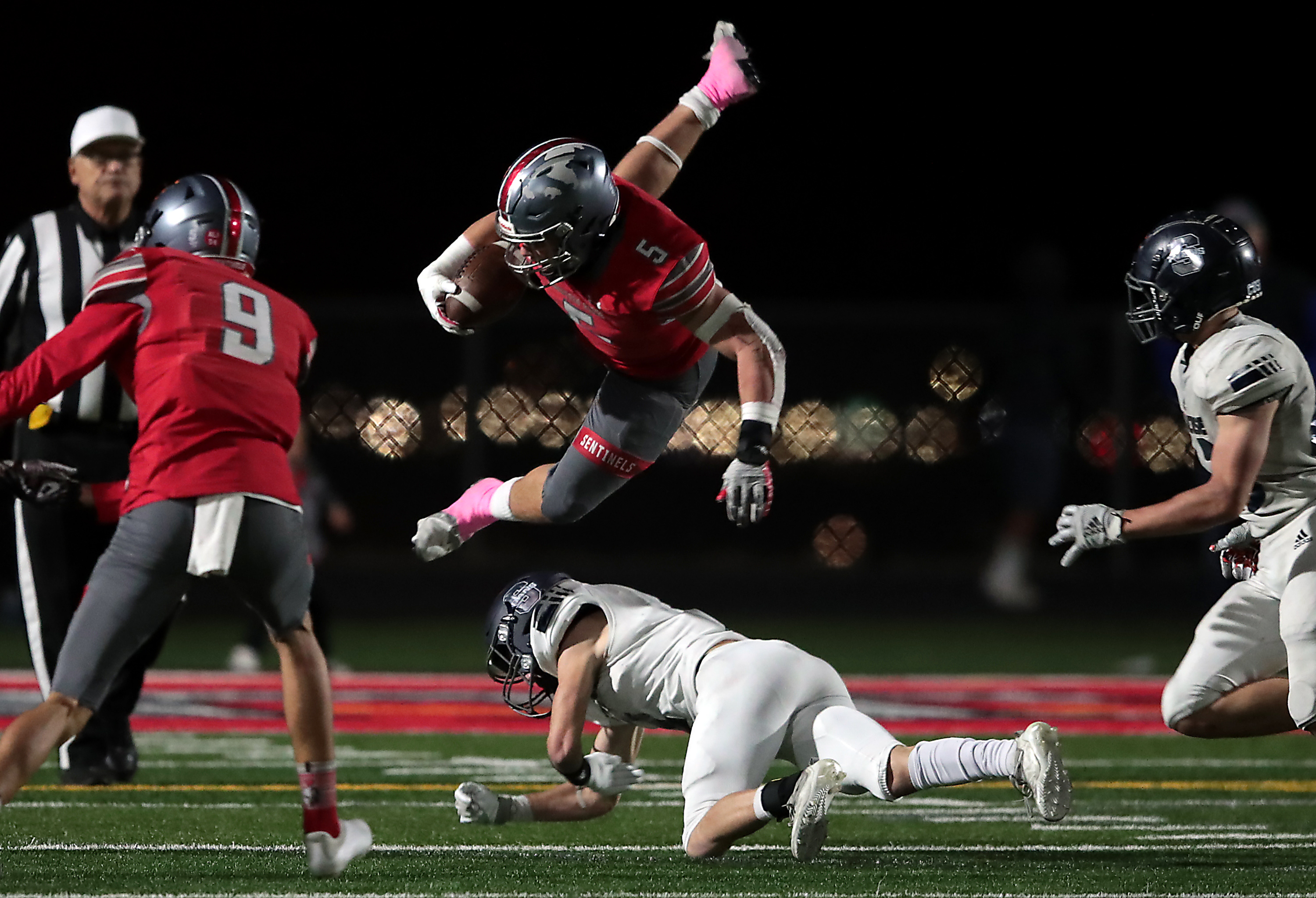 Mountain Ridge’s Cade Uluave flies into the air after being hit by Syracuse’s Braxton Stark in the second round of the state football playoffs in Herriman on Friday, Oct. 29, 2021.