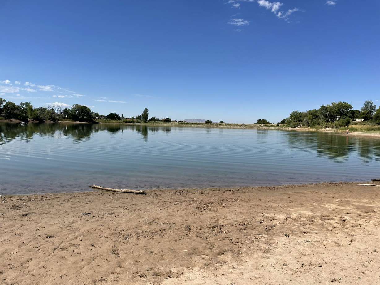Adams Reservoir in Layton is pictured Wednesday. Mary Green says she sunk in mud near the water's edge on Monday.