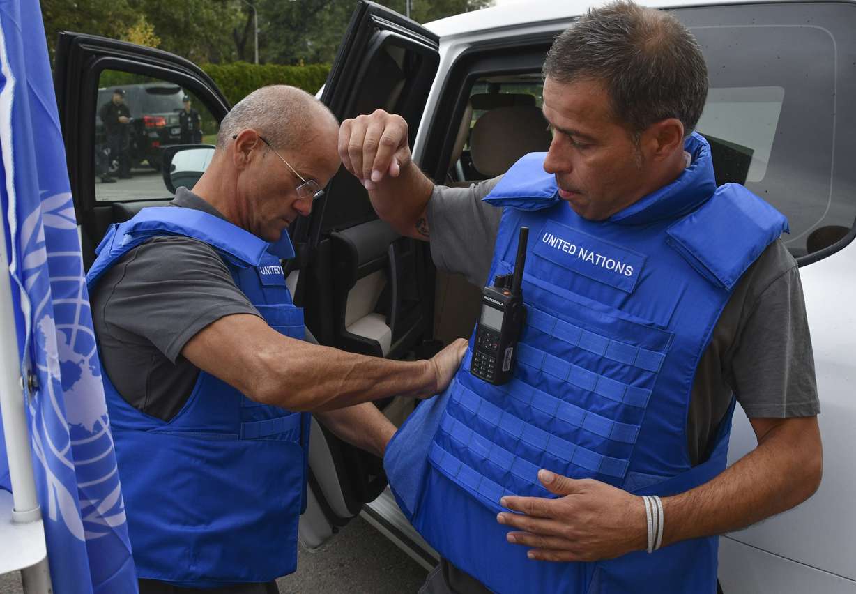 Members of mission from the U.N.'s International Atomic Energy Agency prepare to visit the Zaporizhzhia nuclear power plant in Zaporizhzhia, Ukraine, Thursday.