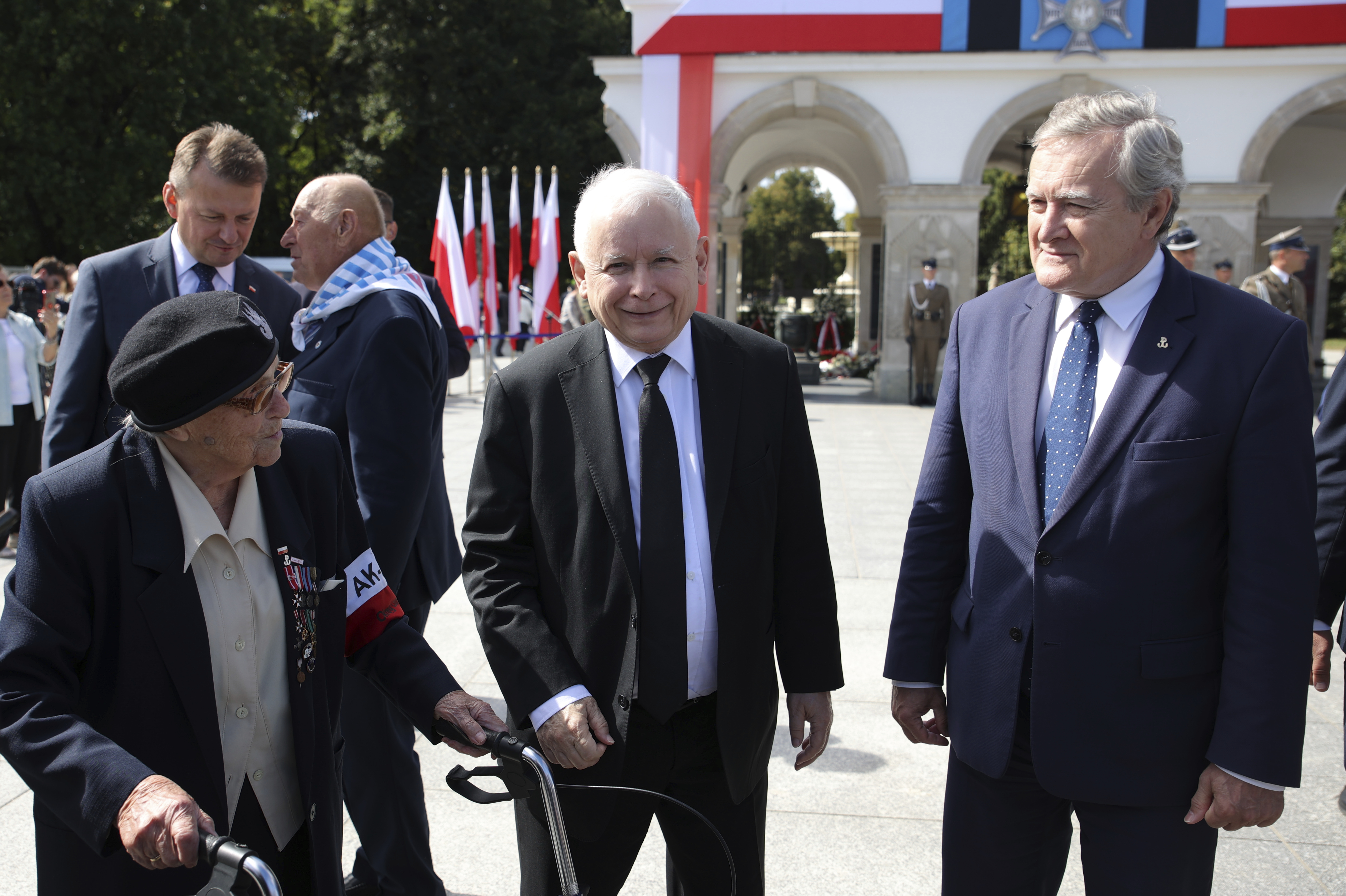 Poland's main ruling party leader Jaroslaw Kaczynski, center, attends a wreath laying ceremony marking national observances of the anniversary of World War II in Warsaw, Poland, Thursday. World War II began on Sept. 1, 1939, with Nazi Germany's bombing and invading Poland, for more than five years of brutal occupation. 