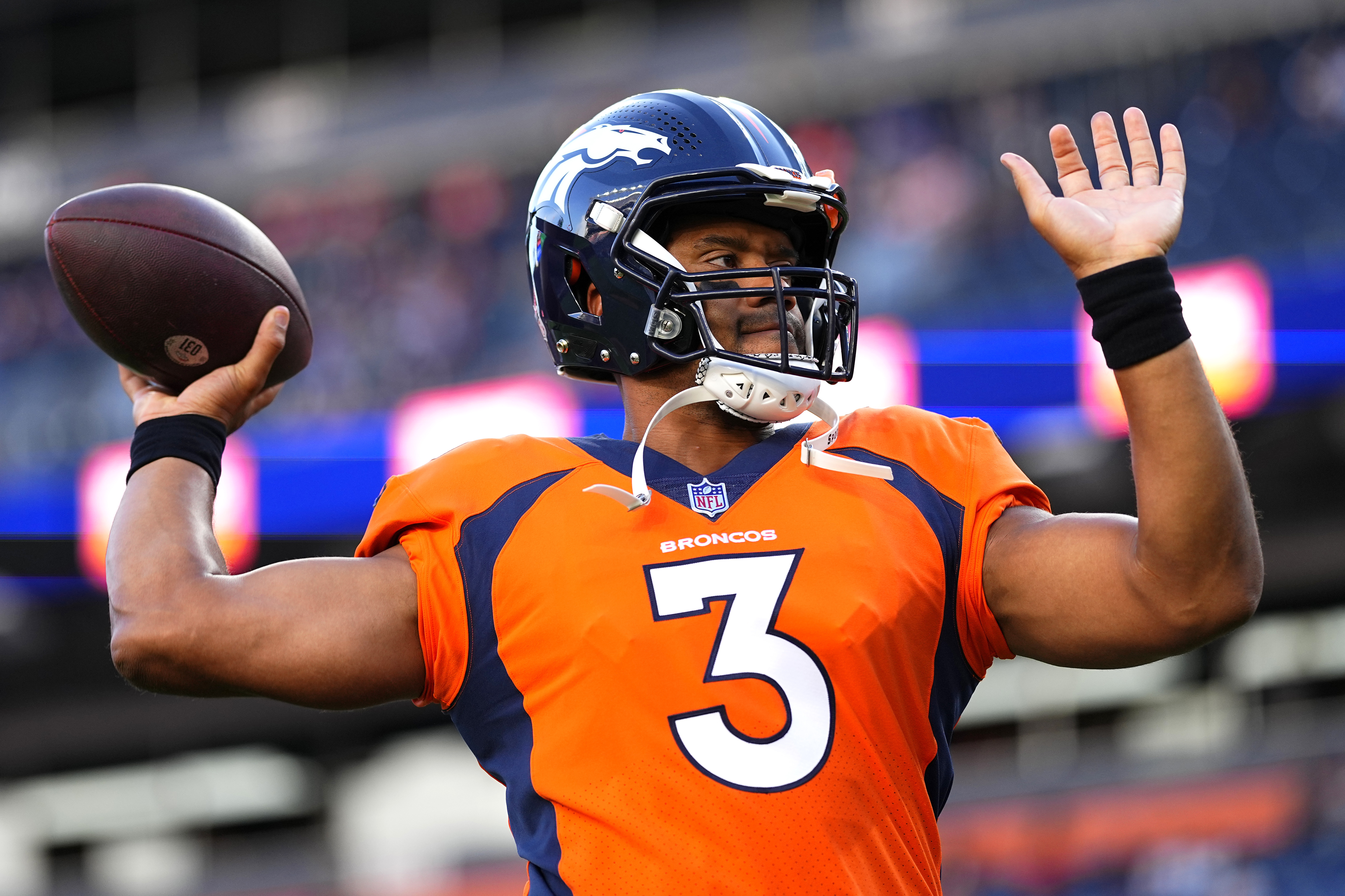 Denver Broncos quarterback Russell Wilson (3) warms up prior to an NFL preseason football game against the Minnesota Vikings, Saturday, Aug. 27, 2022, in Denver.